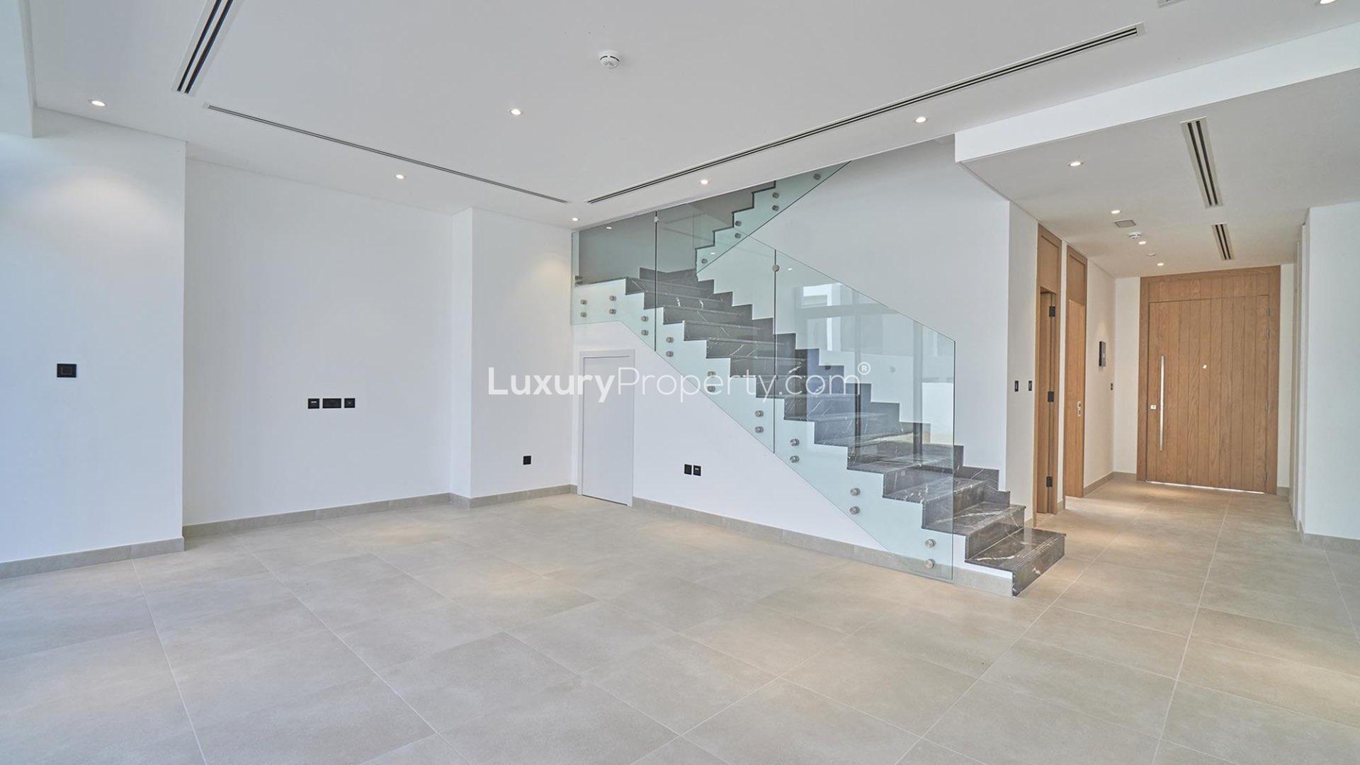 Empty bedroom with built-in wardrobe in Jumeirah Luxury townhouse, Jumeirah Golf Estates