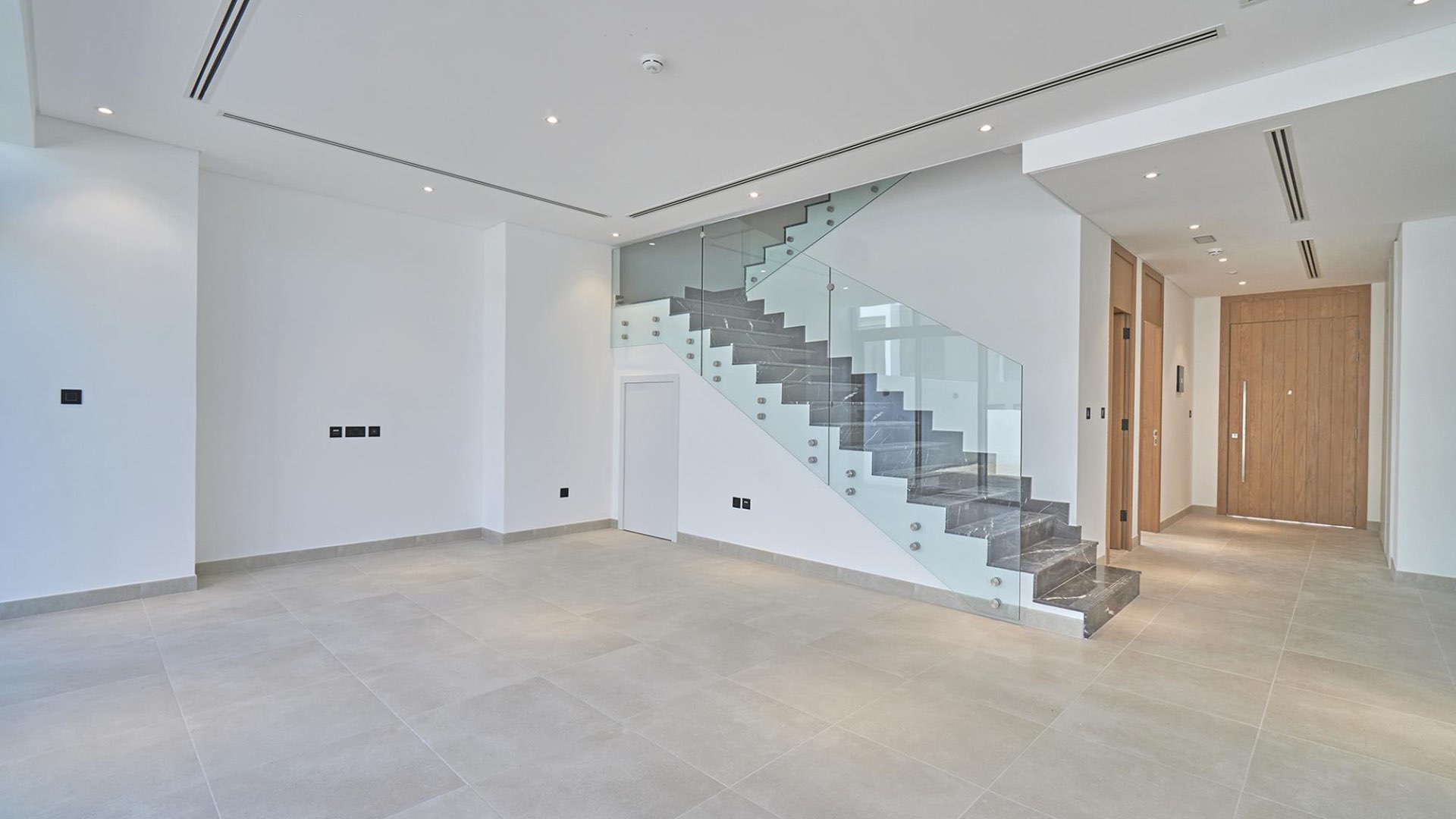 Empty bedroom with built-in wardrobe in Jumeirah Luxury townhouse, Jumeirah Golf Estates