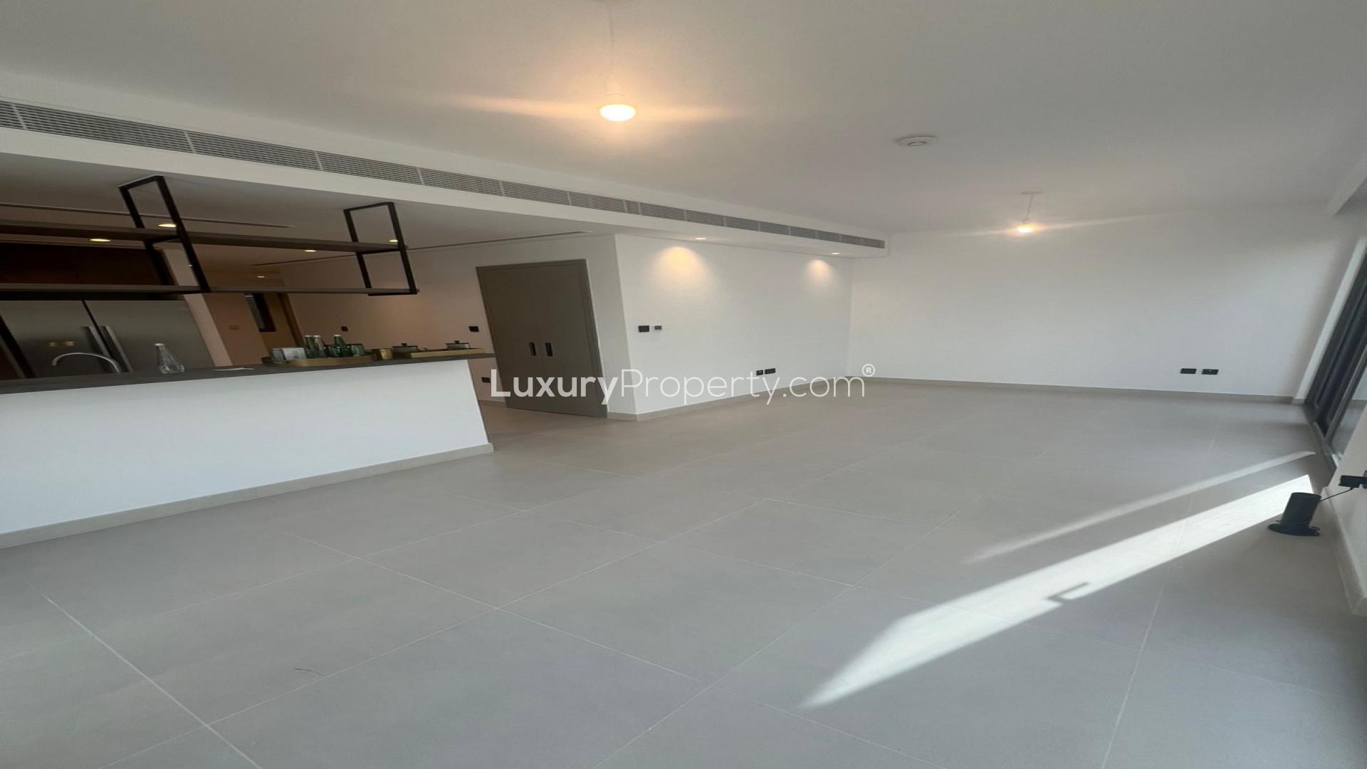 Modern kitchen in Aura Gardens townhouse, Tilal Al Ghaf, spacious layout with sleek finishes