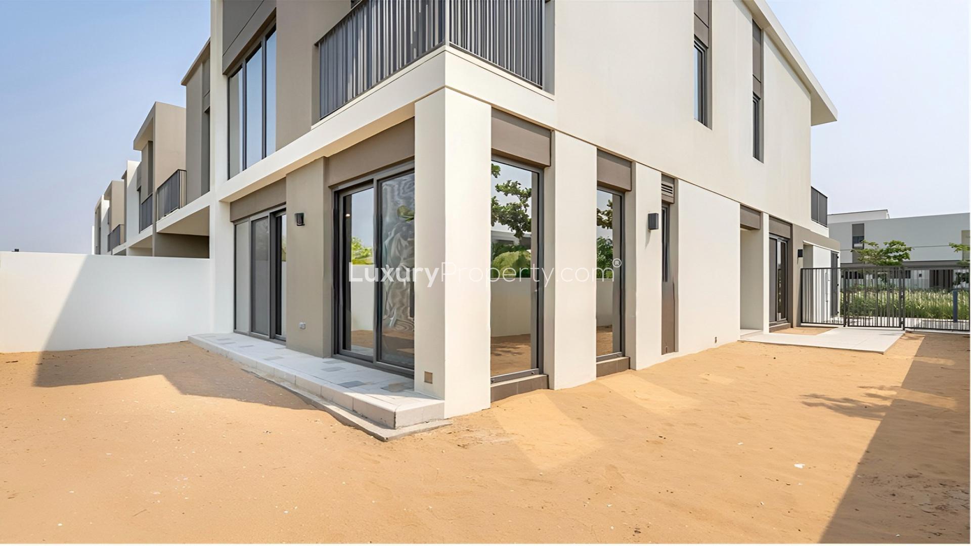 End 4-bed townhouse for sale in Aura Gardens, Tilal Al Ghaf, modern exterior view