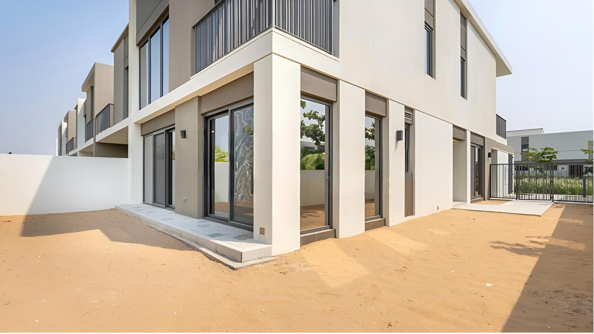 End 4-bed townhouse for sale in Aura Gardens, Tilal Al Ghaf, modern exterior view