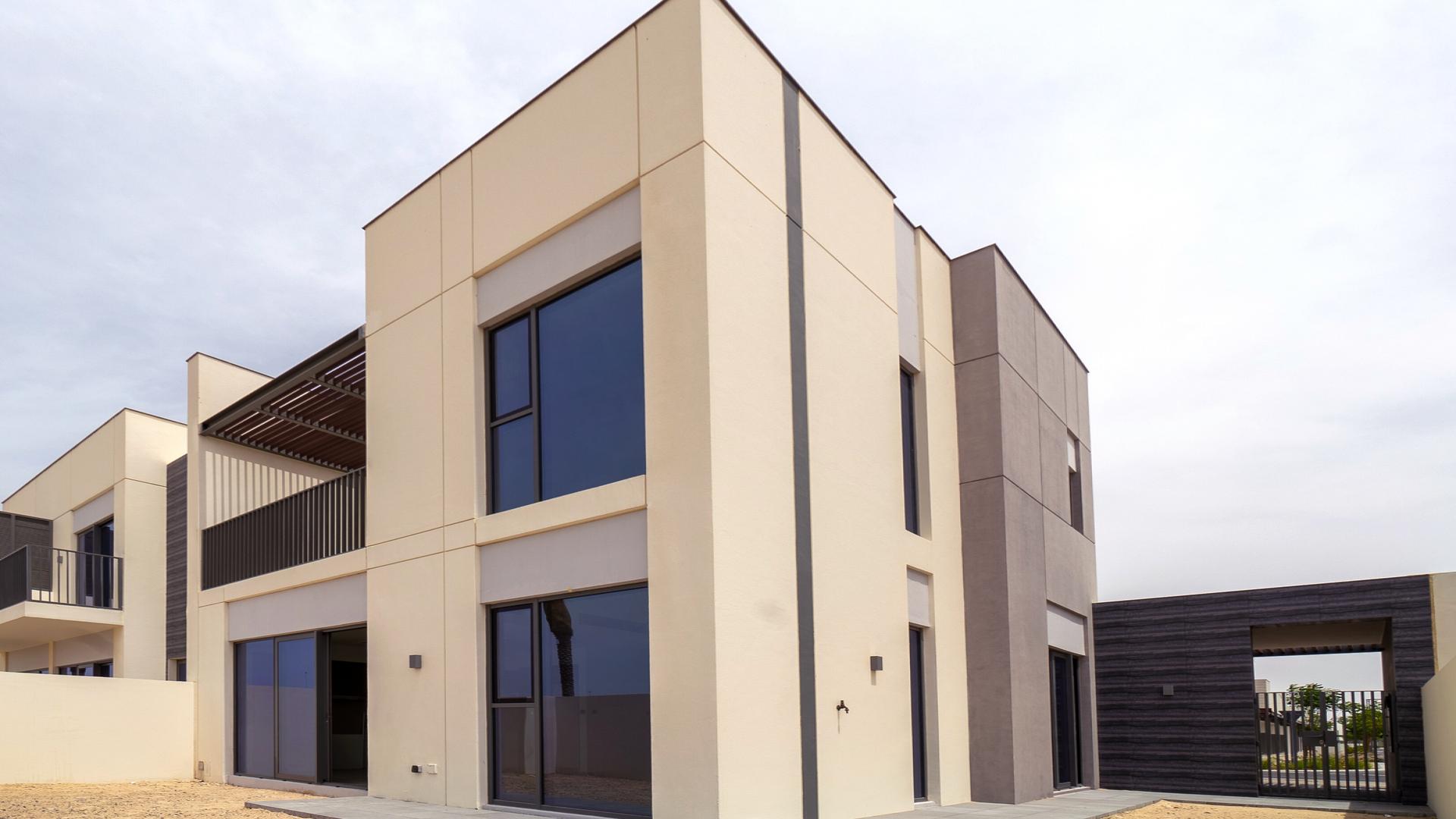 Interior of bright, modern townhouse in Arabian Ranches 3, Joy community, with large windows