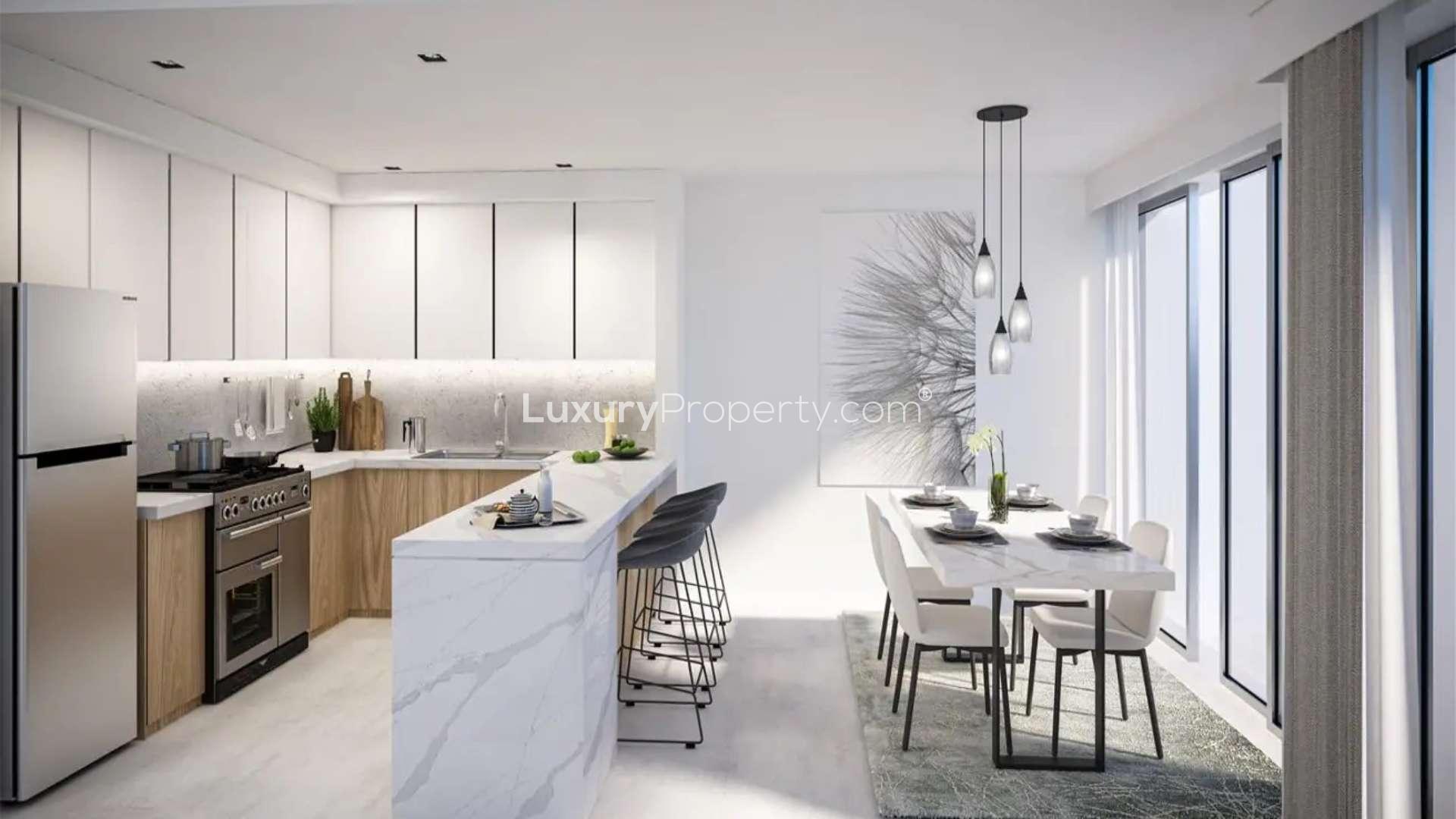 Townhouse exterior in Villanova, Dubai Land with lush garden and nearby park walkway