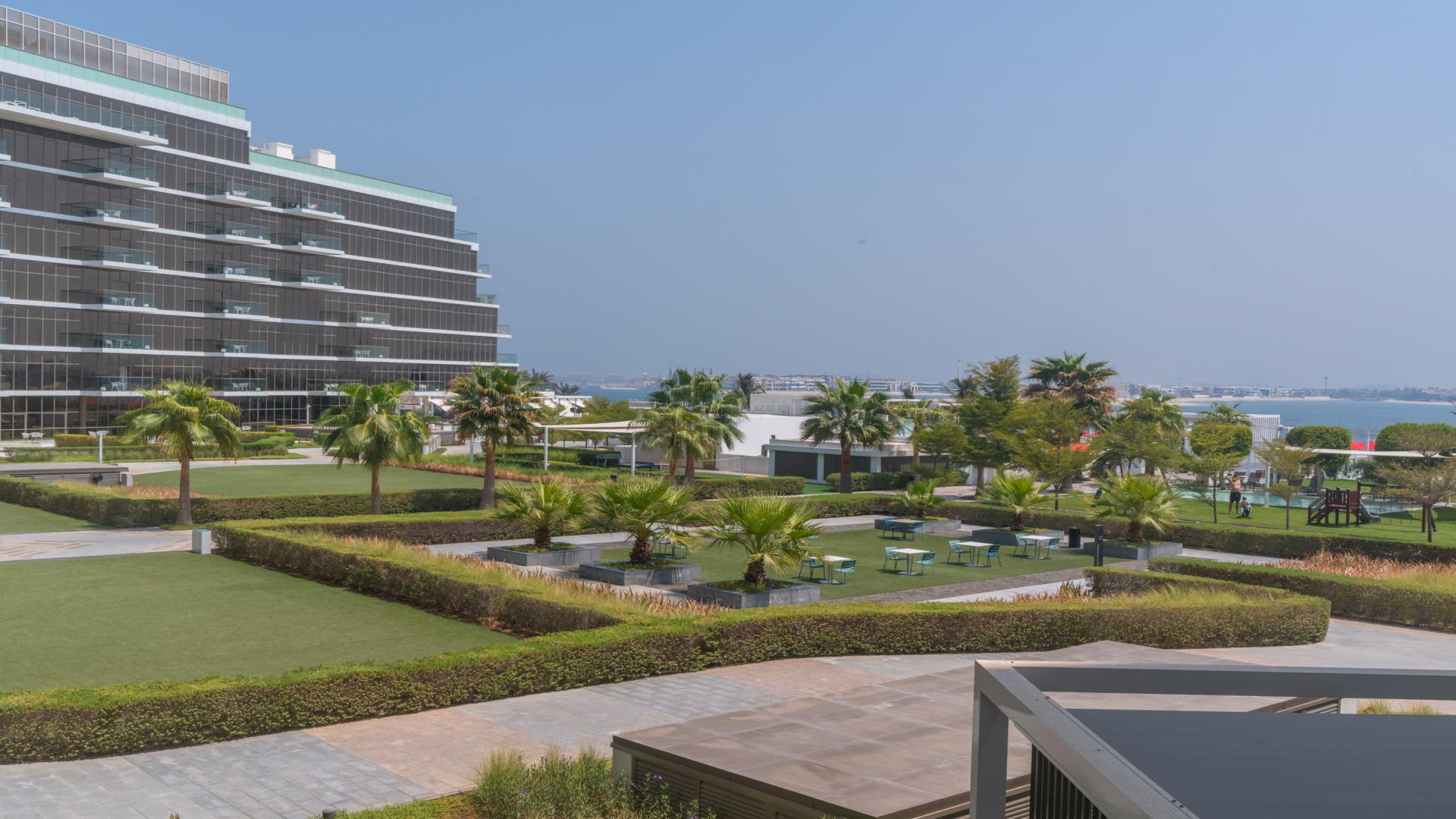 Modern living room in 4-bedroom townhouse, The8, Palm Jumeirah, with sleek decor and natural light