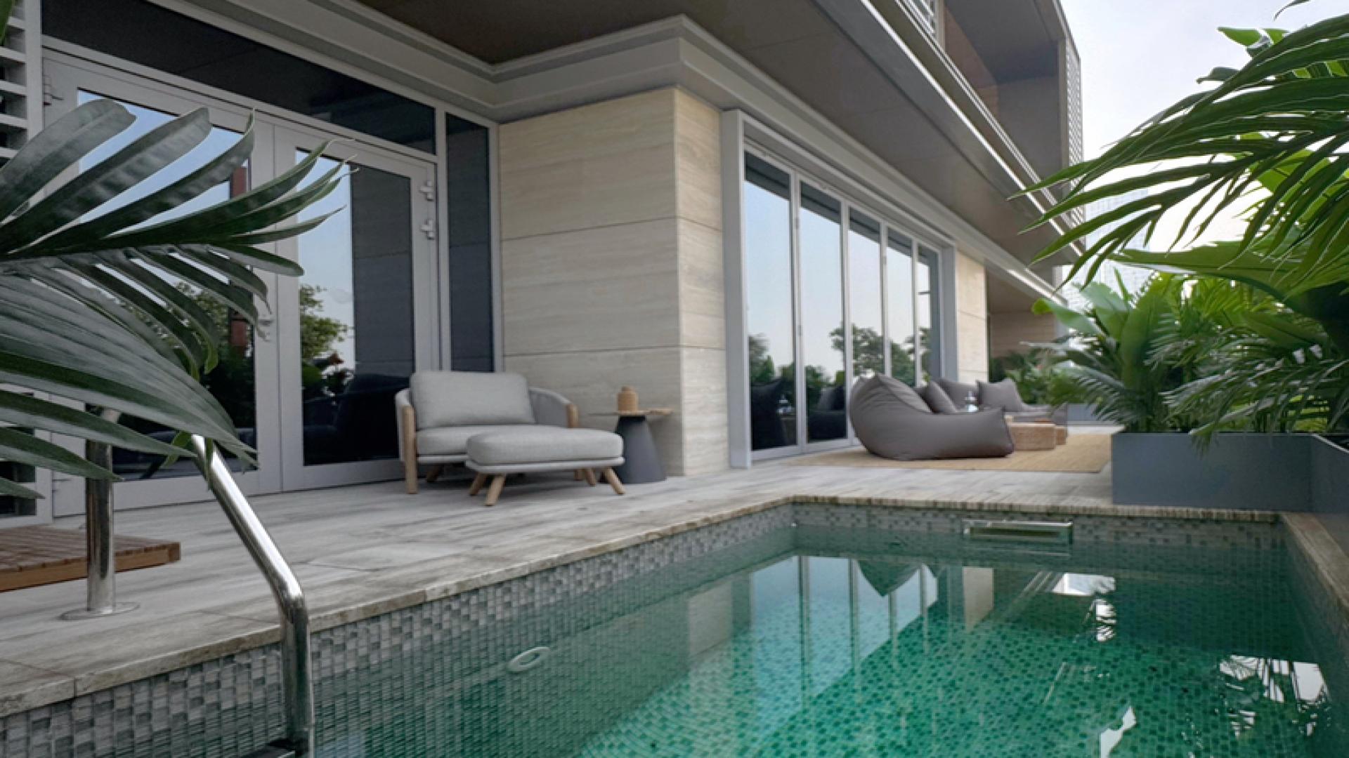 Elegant Bluewaters Dubai townhouse facade with lush greenery and modern architecture