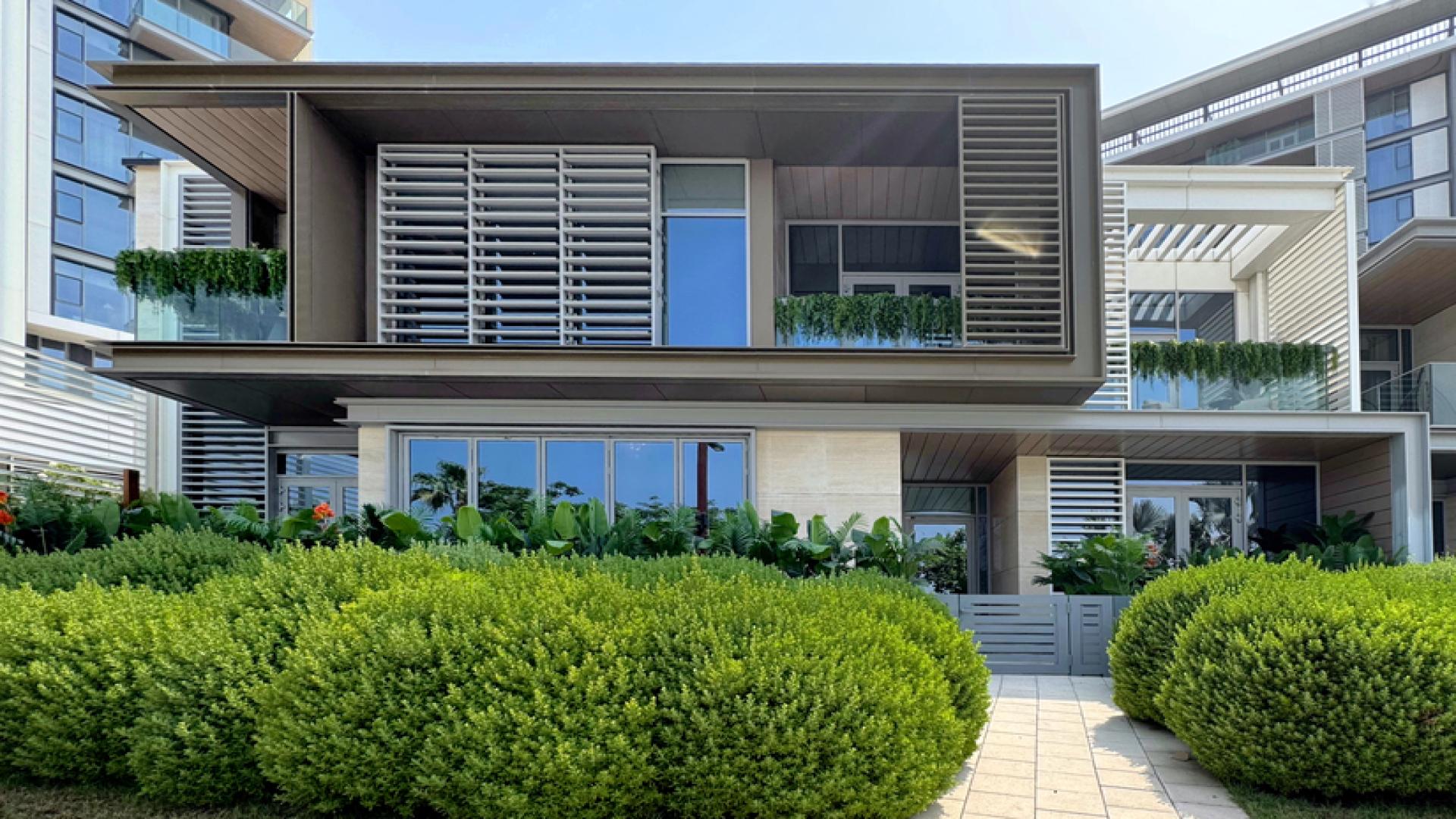 Elegant living area in Bluewaters duplex townhouse, featuring ocean views and modern decor
