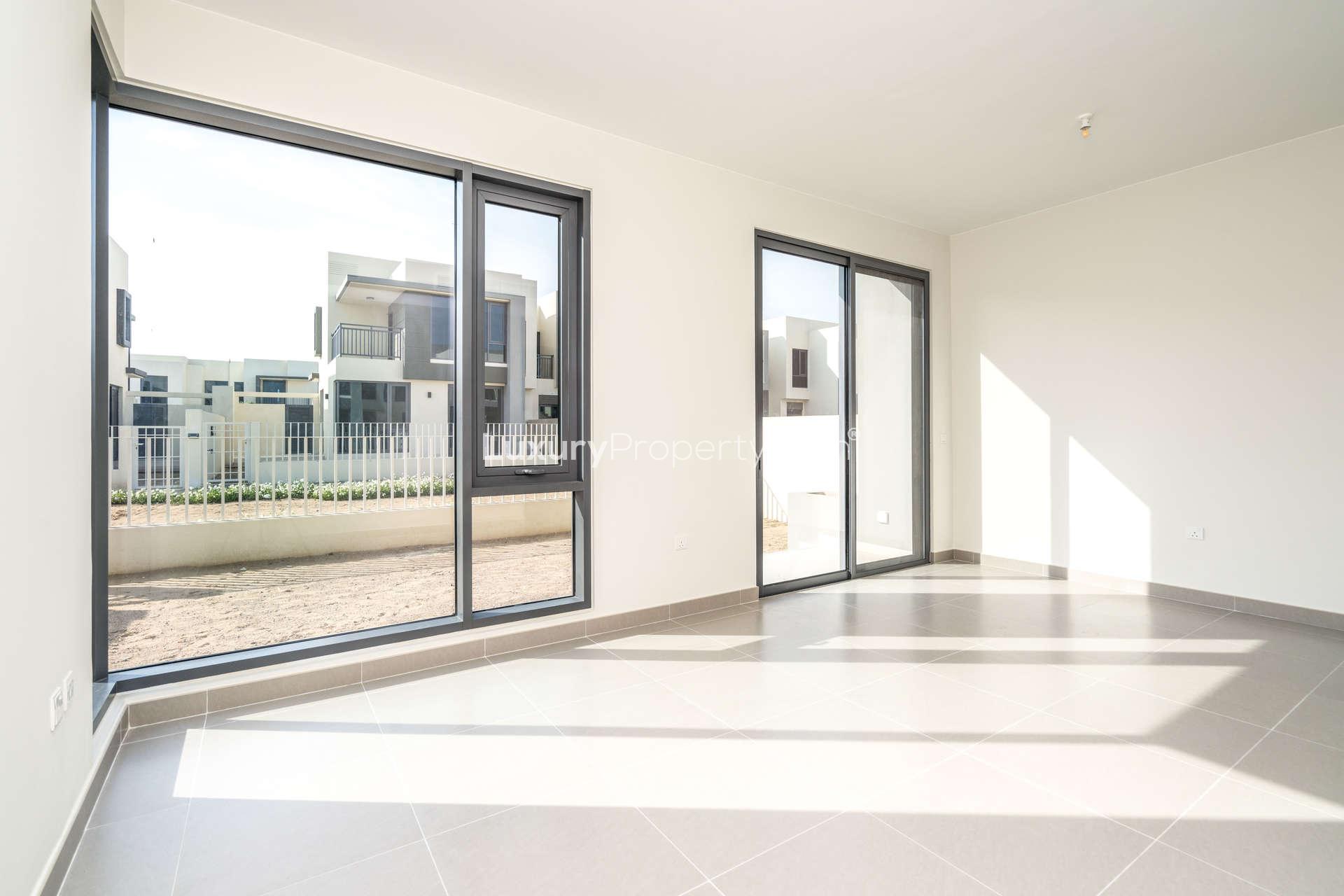 Bright interior of corner villa in Maple 2, Dubai Hills Estate, with large windows