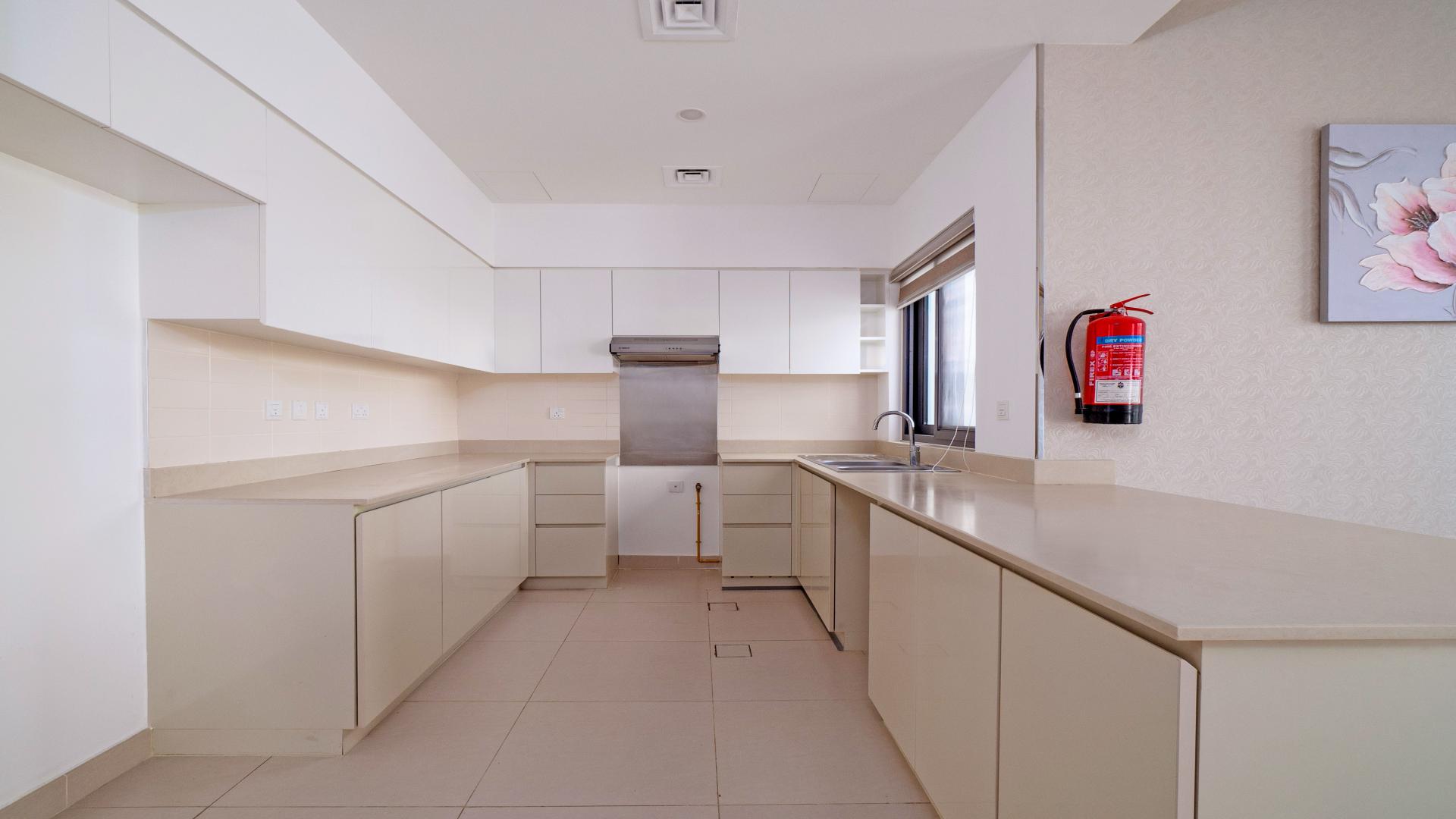 Elegant townhouse exterior with garden in Maple, Dubai Hills Estate for sale