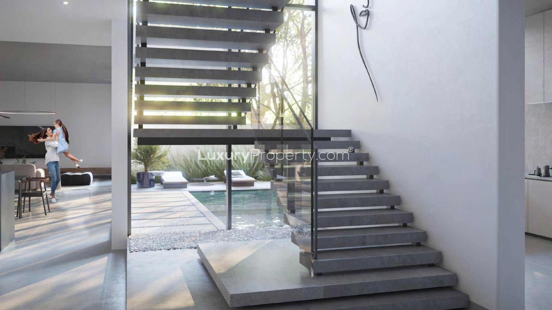 Modern Jouri Hills townhouse interior with garden view, spacious living area, Jumeirah Golf Estates