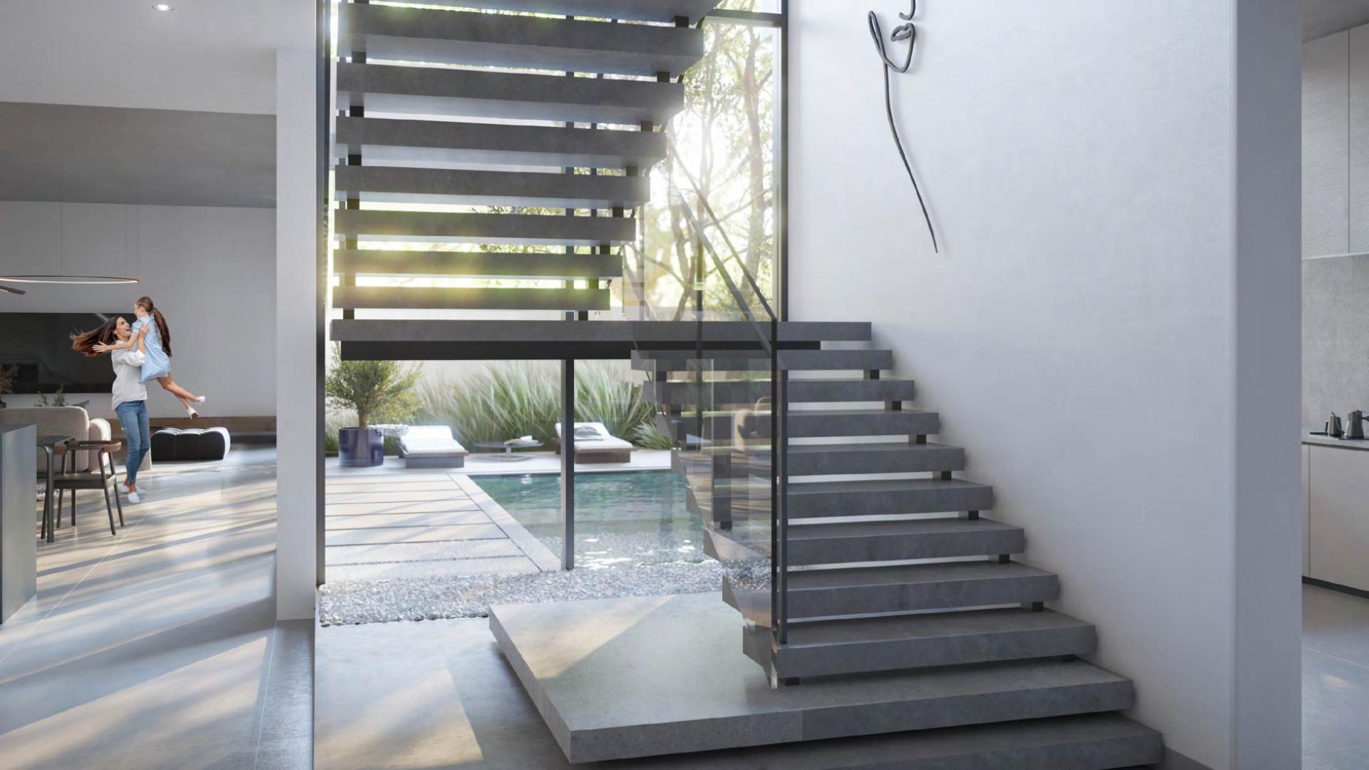 Modern Jouri Hills townhouse interior with garden view, spacious living area, Jumeirah Golf Estates