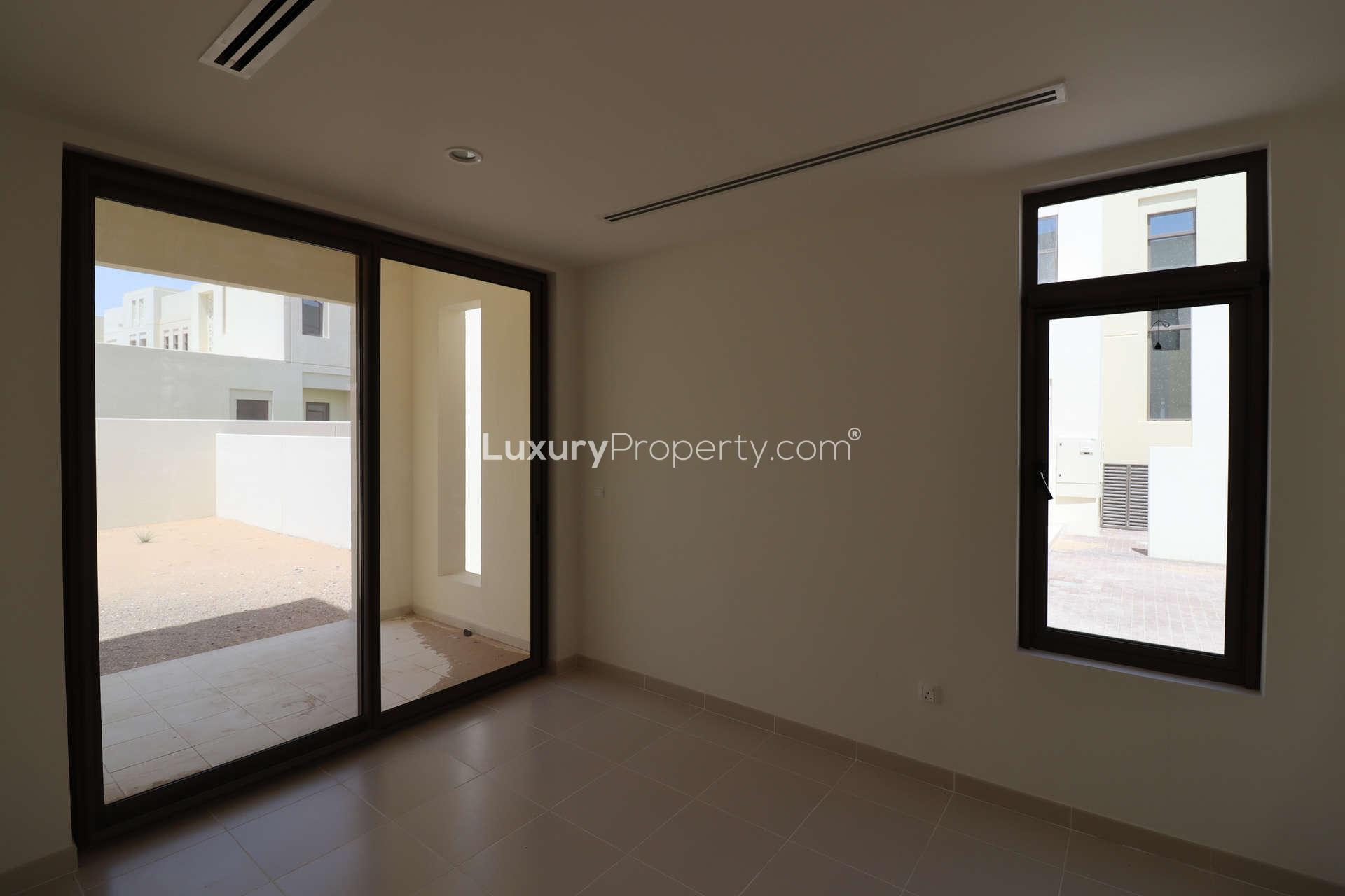 Empty room with large window in elegant 4-bed townhouse, Mira Oasis, Reem