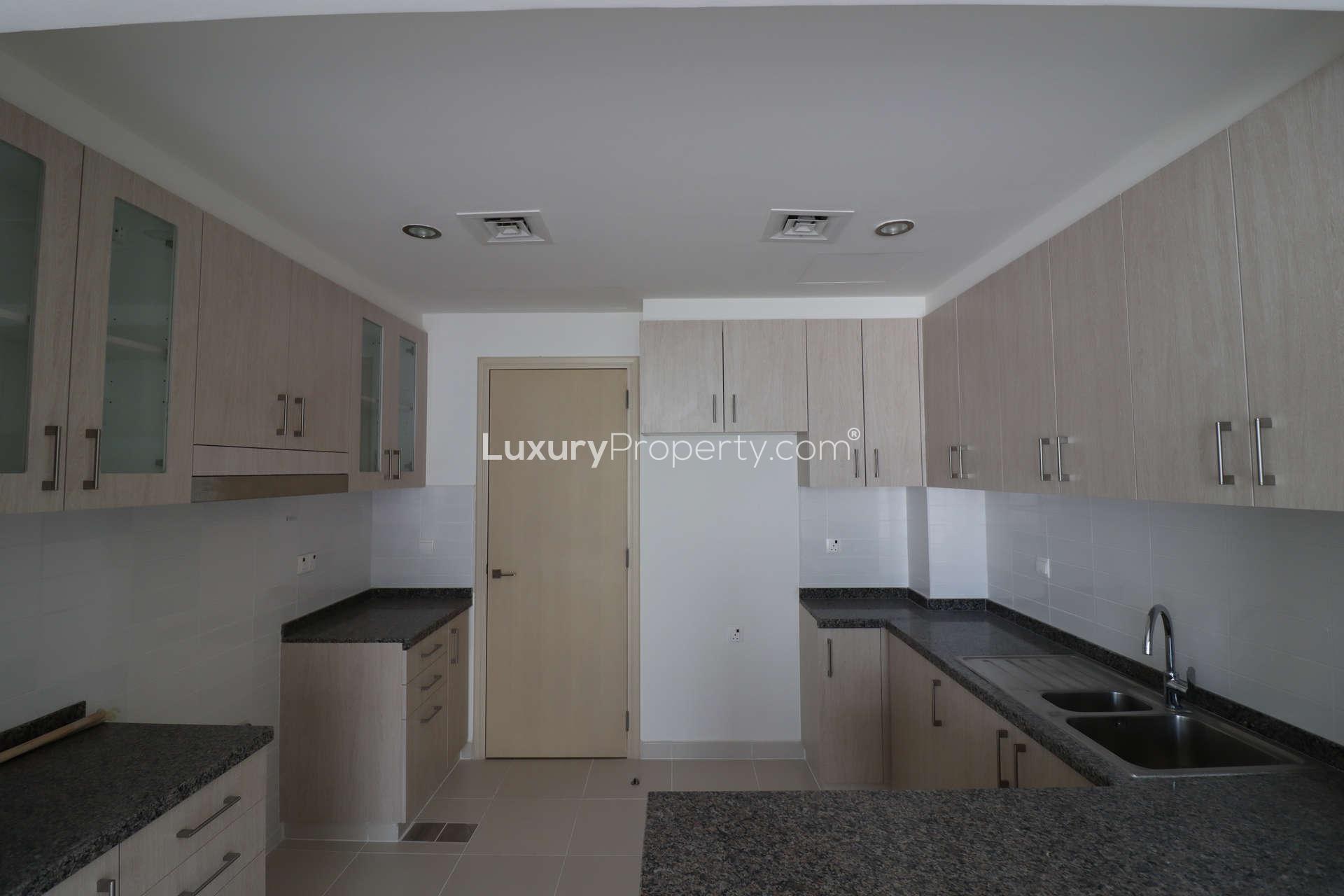 Elegant 4-bed townhouse exterior with landscaped garden in Mira Oasis, Reem community