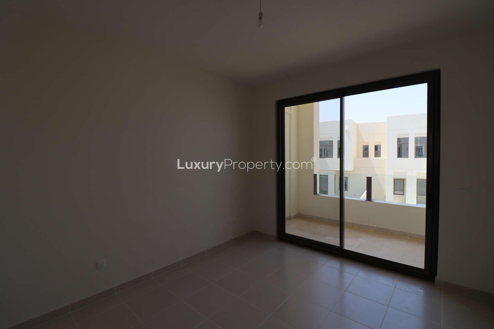 Modern kitchen in 4-bed townhouse, Mira Oasis, Reem community, featuring sleek cabinetry and countertops