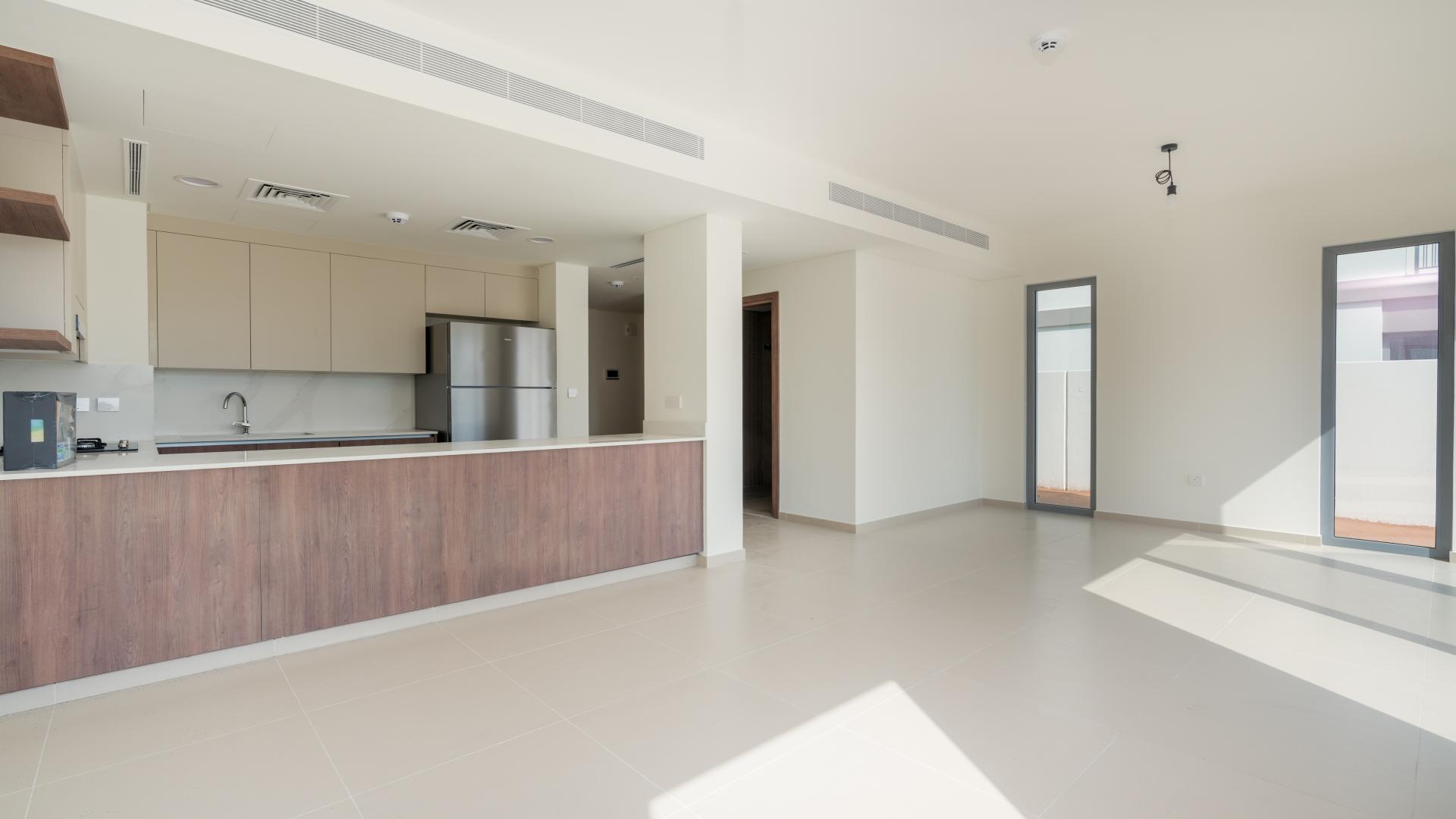 Modern kitchen and living area in Elan townhouse, Tilal Al Ghaf, for sale