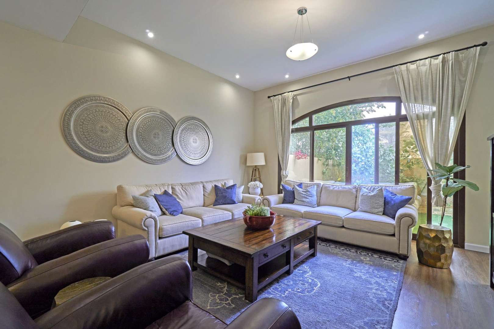 Modern kitchen in 4-bedroom townhouse for sale, Al Naseem, Mudon. Marble countertops, sleek design