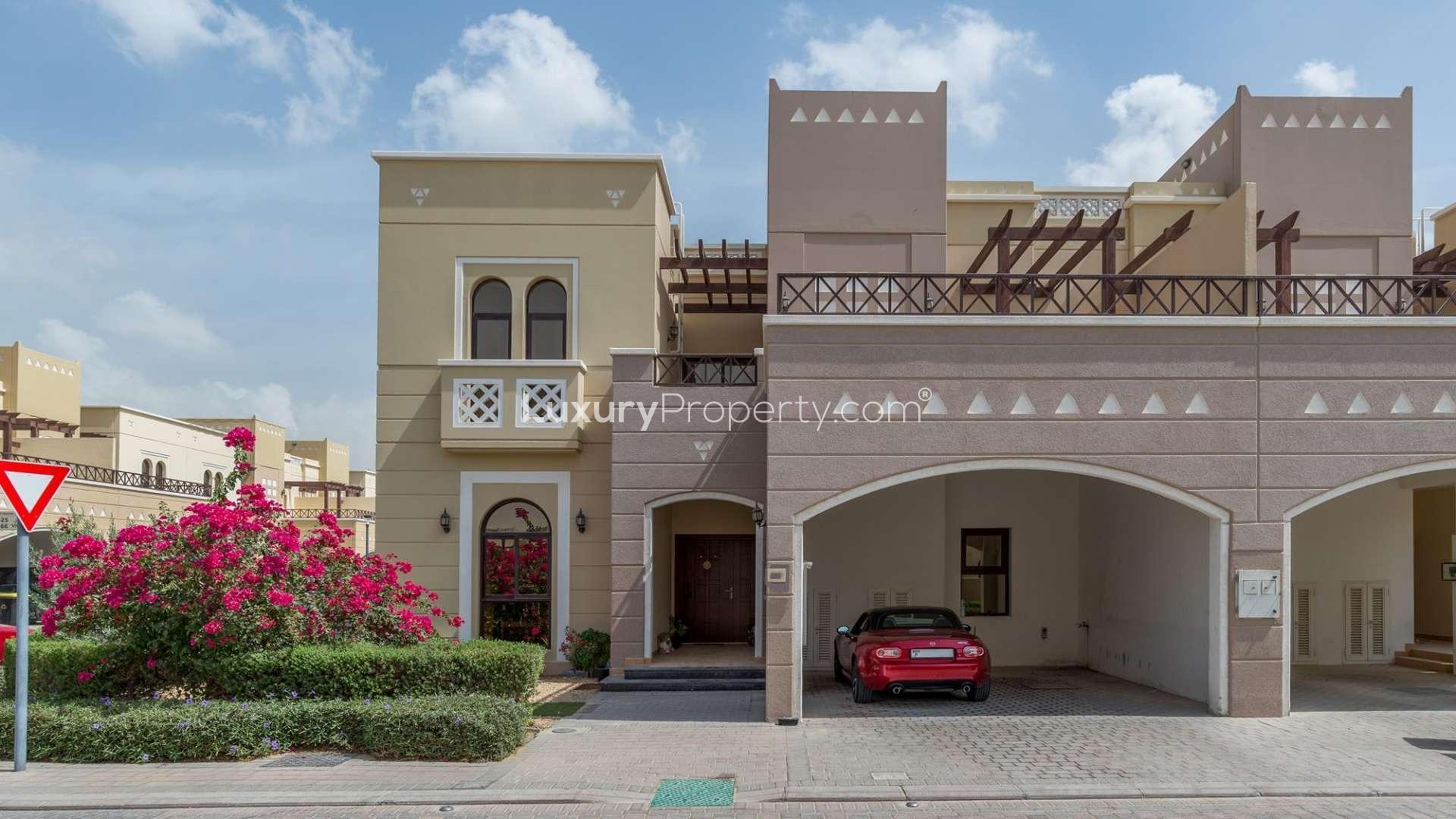 Scenic path lined with palm trees near 4-bedroom townhouse in Al Naseem, Mudon