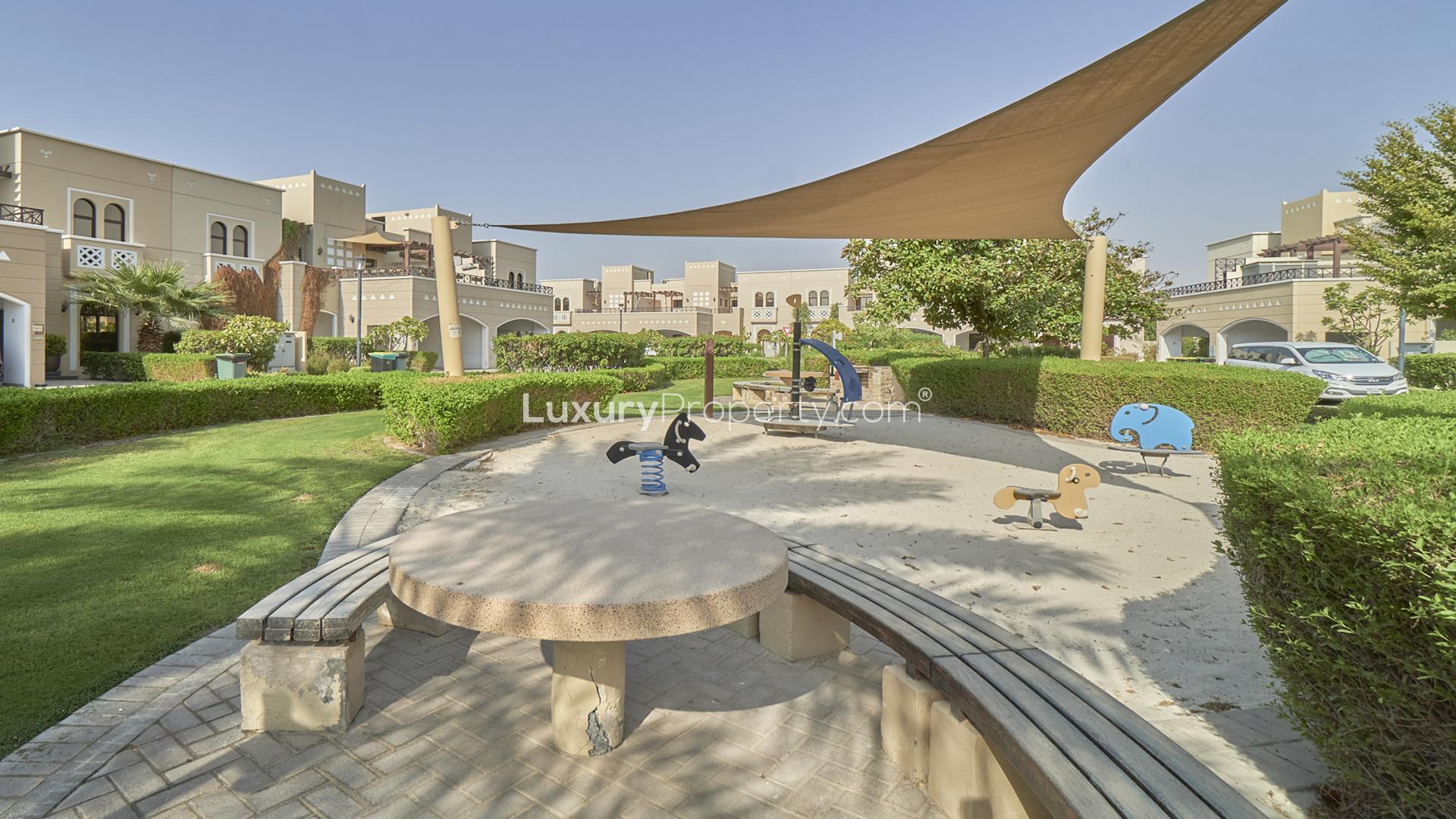 Spacious 4-bedroom townhouse exterior in Naseem, Mudon with garden and terrace