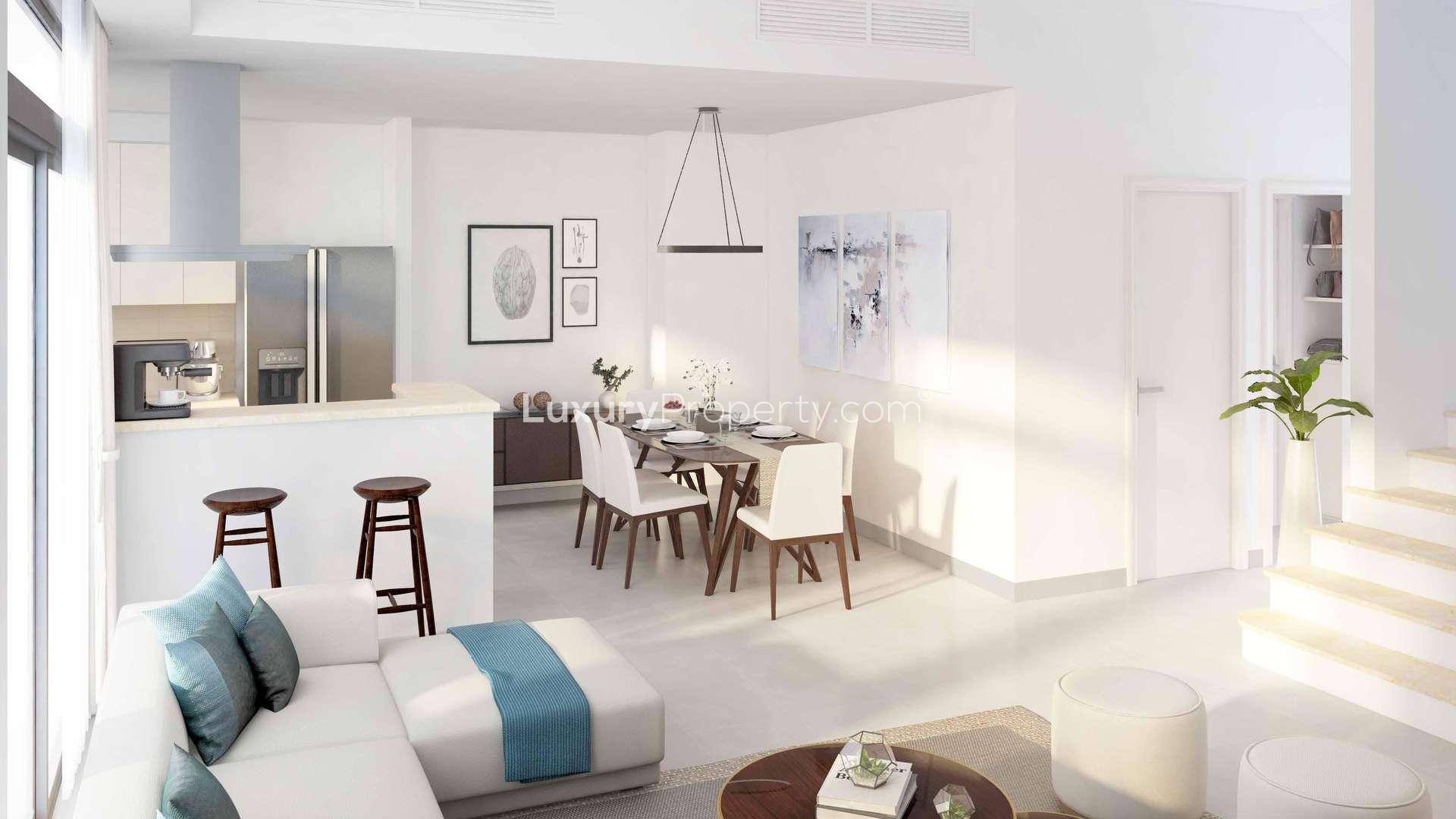 Modern open-plan kitchen and living area in Naseem Townhouse, Dubai Town Square