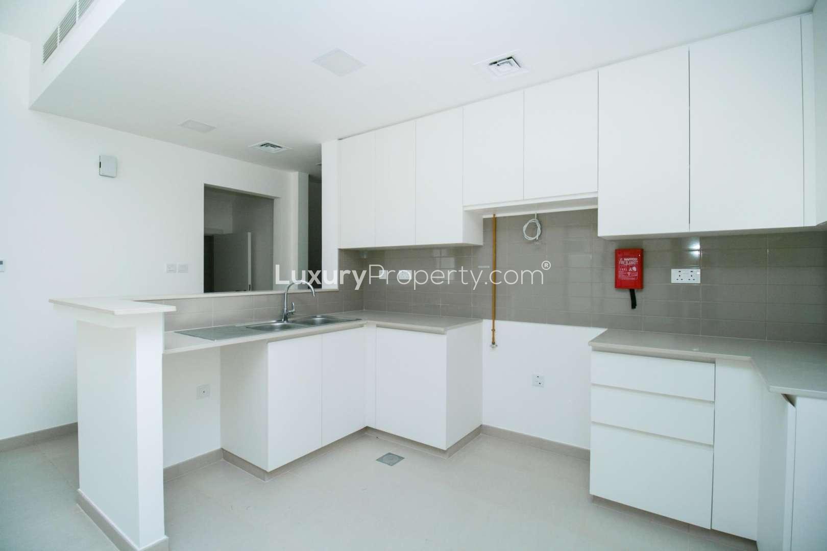 Outdoor sports court at Naseem Townhouses, Town Square community, near four-bedroom townhouse for sale