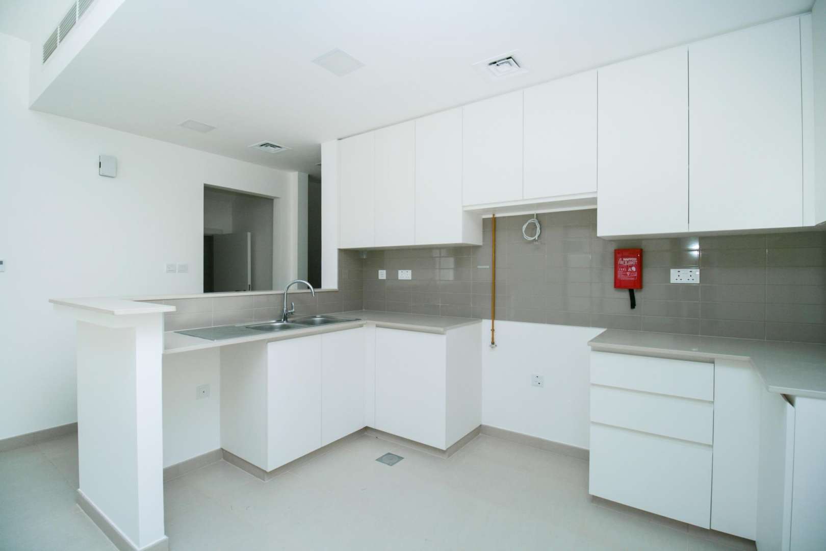 Outdoor sports court at Naseem Townhouses, Town Square community, near four-bedroom townhouse for sale