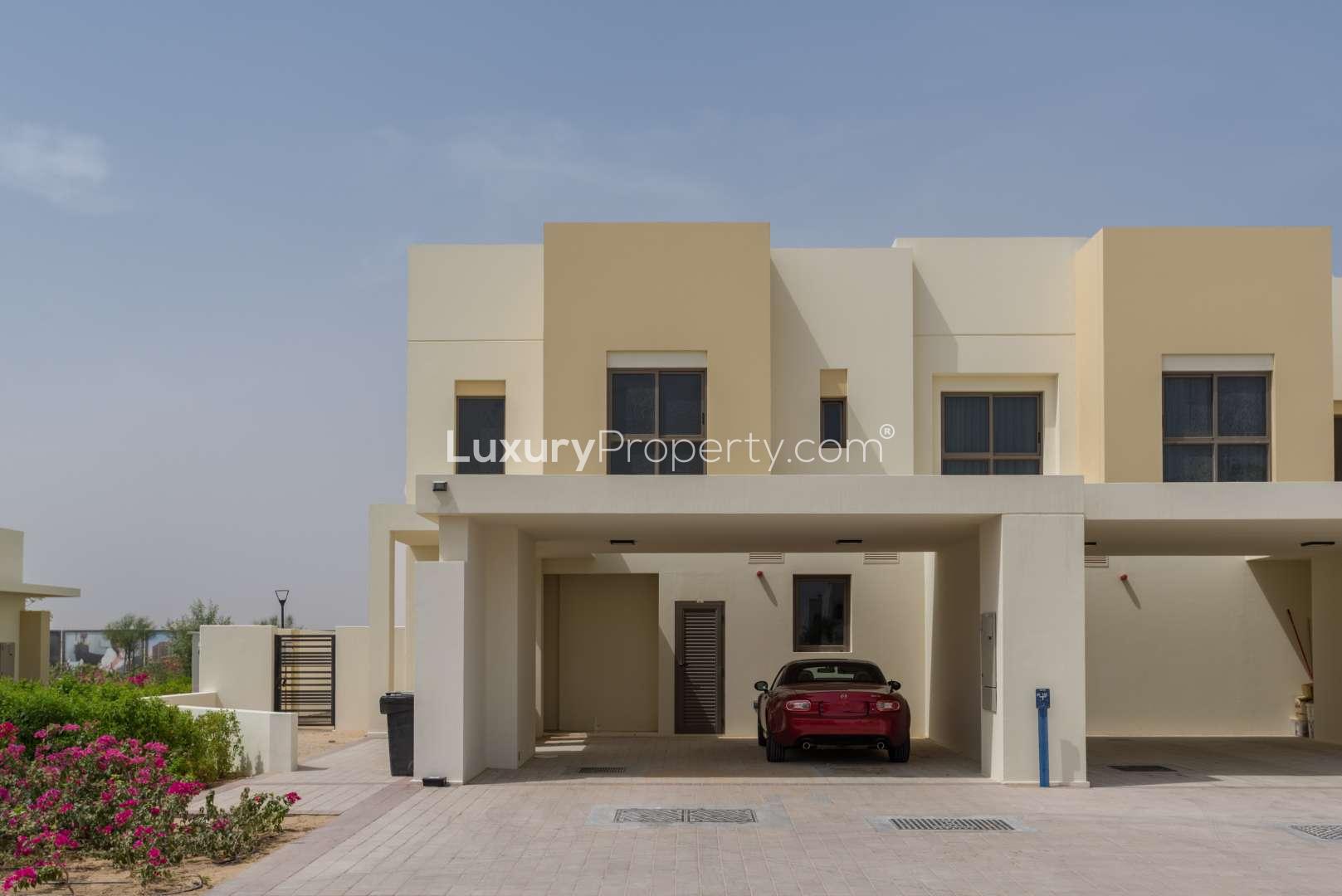 Bright hallway and staircase in four-bedroom Naseem Townhouse, Town Square Dubai