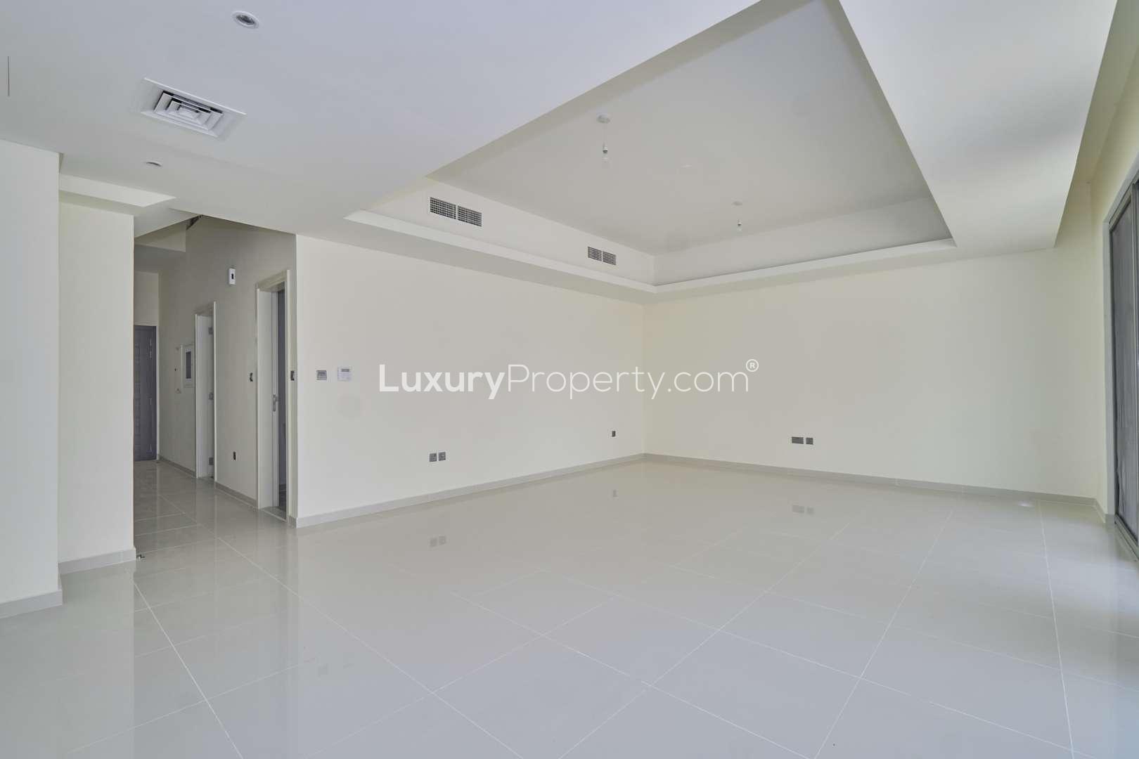 Spacious living room with large windows in 4-bedroom townhouse, Primrose, Akoya by DAMAC Hills 2