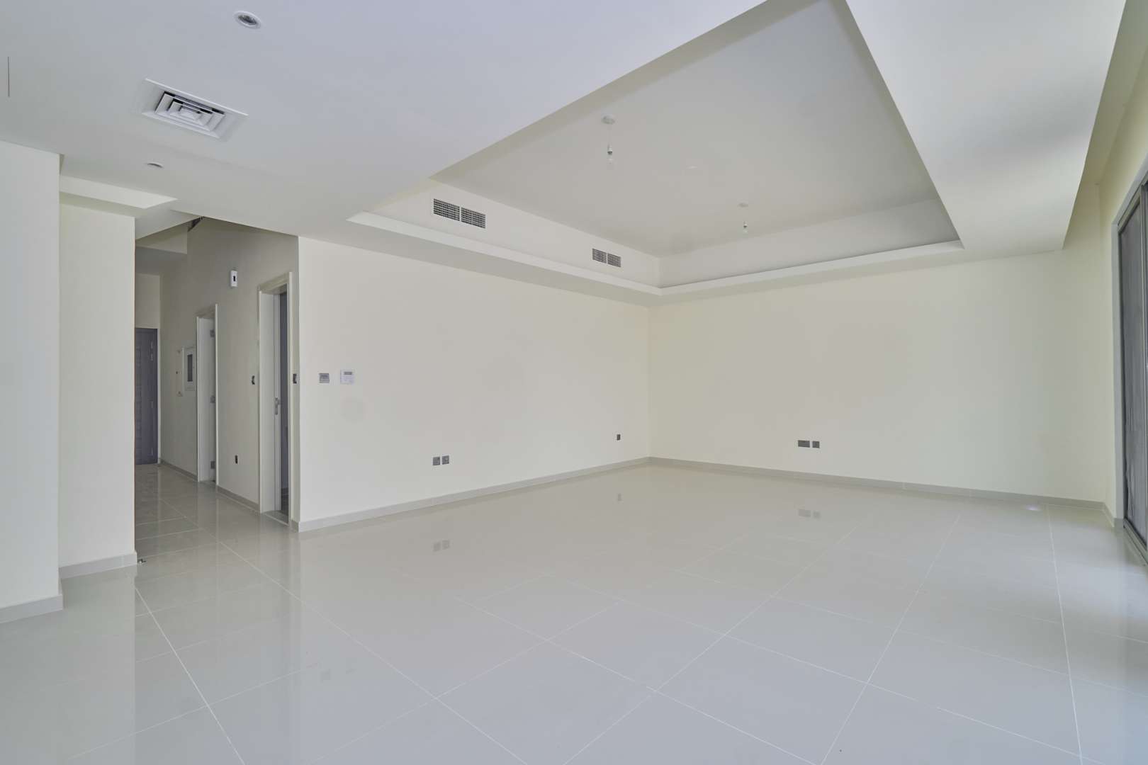 Spacious living room with large windows in 4-bedroom townhouse, Primrose, Akoya by DAMAC Hills 2