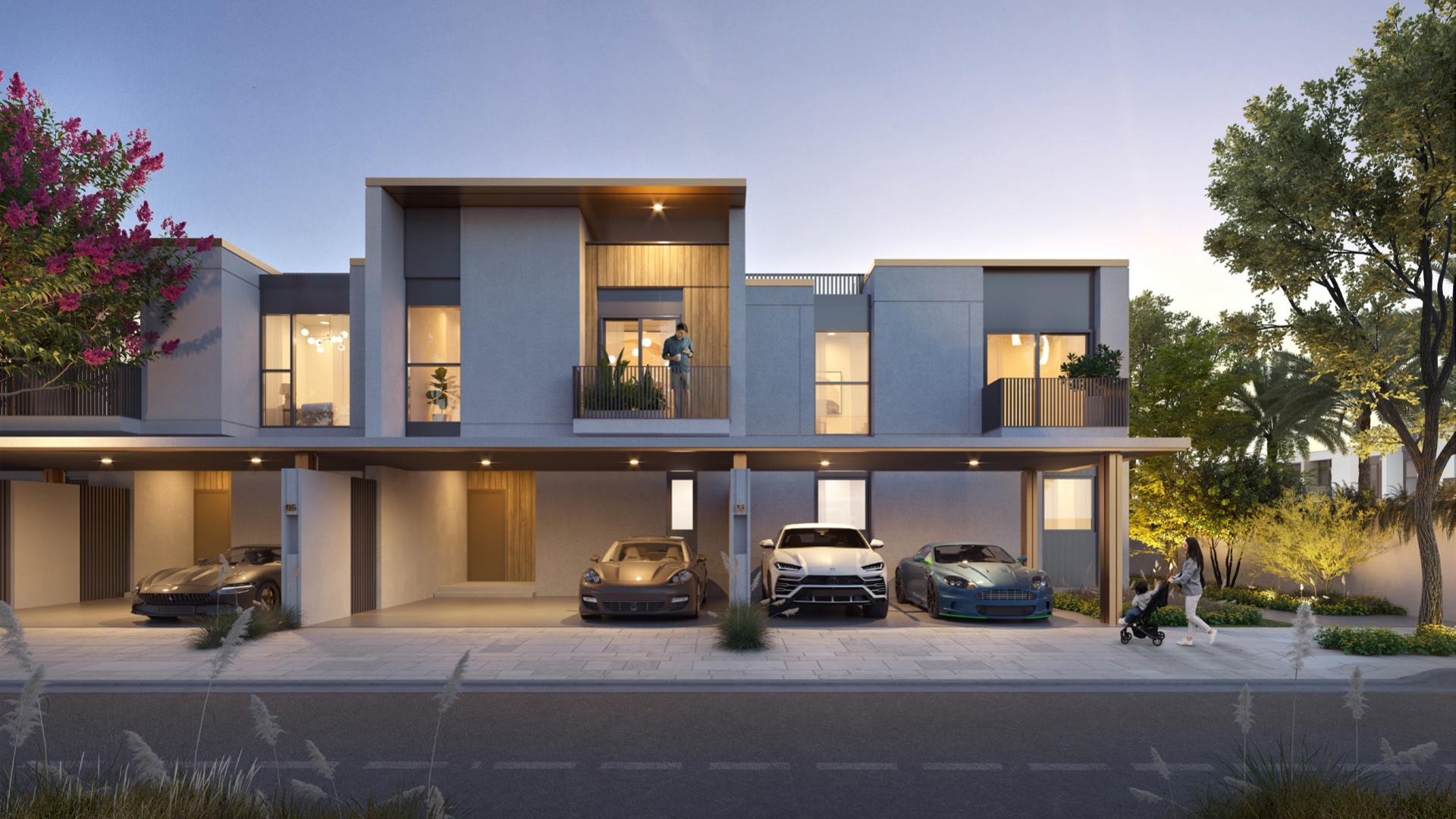 Modern bedroom in Arabian Ranches townhouse with large window and garden view