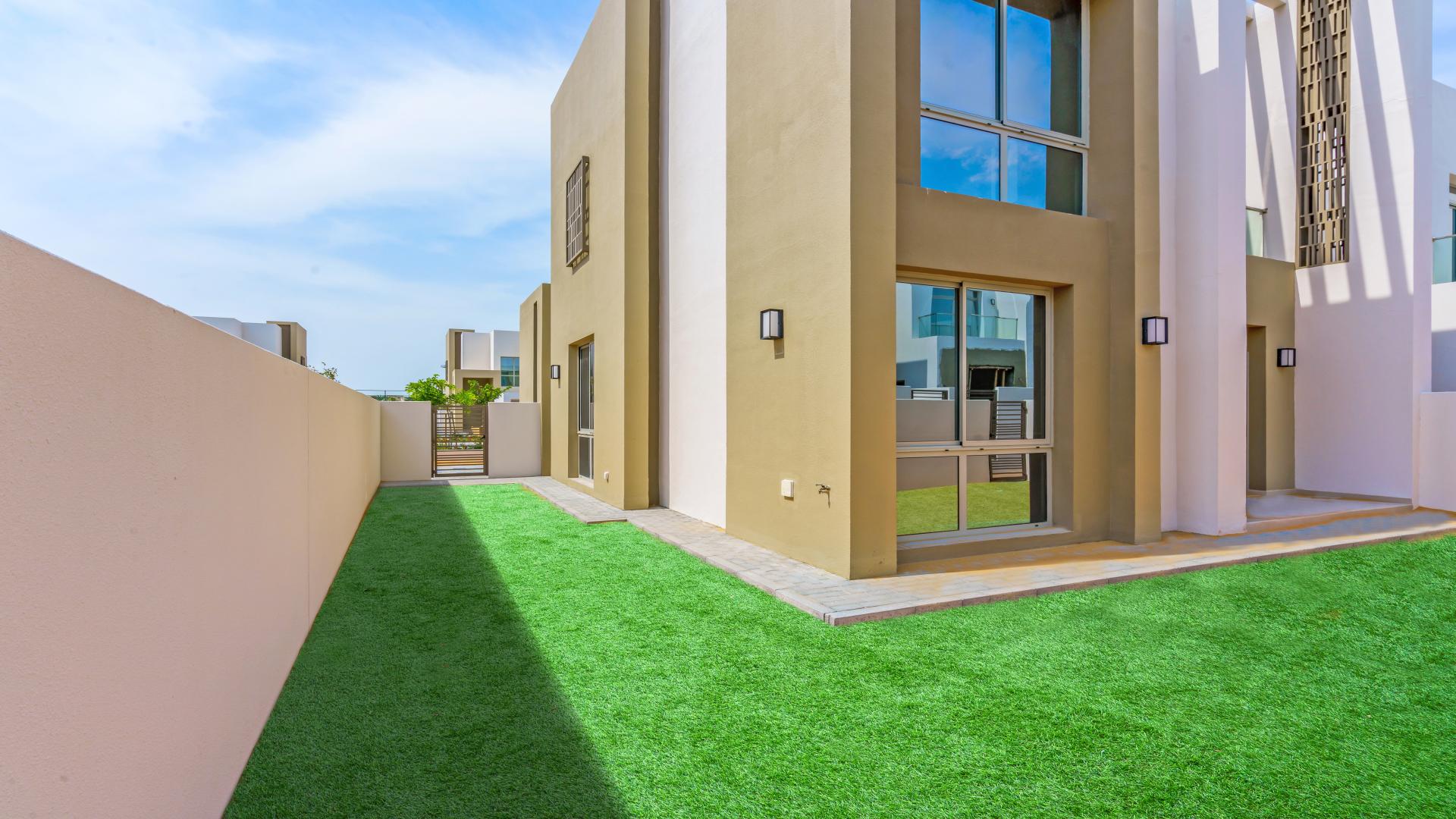 Modern kitchen with sleek countertops in 4-bed townhouse, Reem Community, Arabian Ranches 2