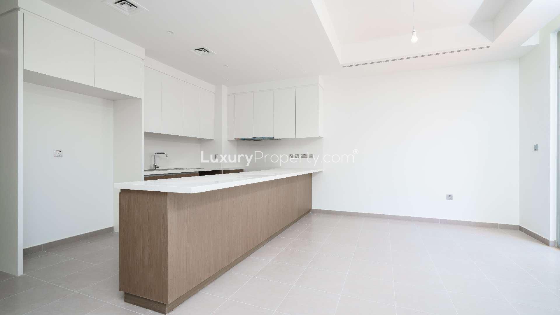 Modern kitchen in 4-bed townhouse, Reem Community, Arabian Ranches 2, with open layout