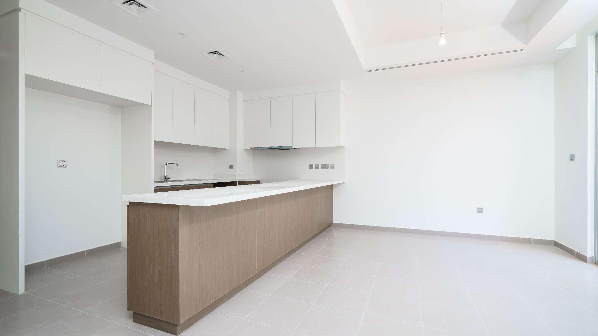 Modern kitchen in 4-bed townhouse, Reem Community, Arabian Ranches 2, with open layout