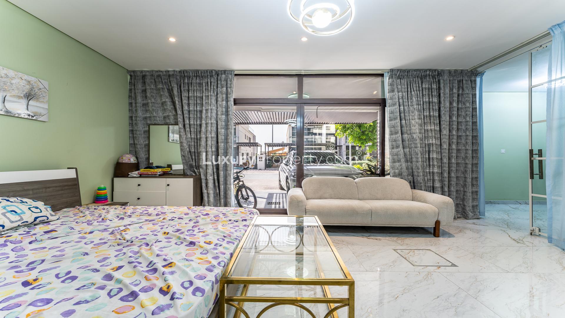 Upgraded villa bedroom with modern decor in Veneto Villas, Damac Hills, Trevi community