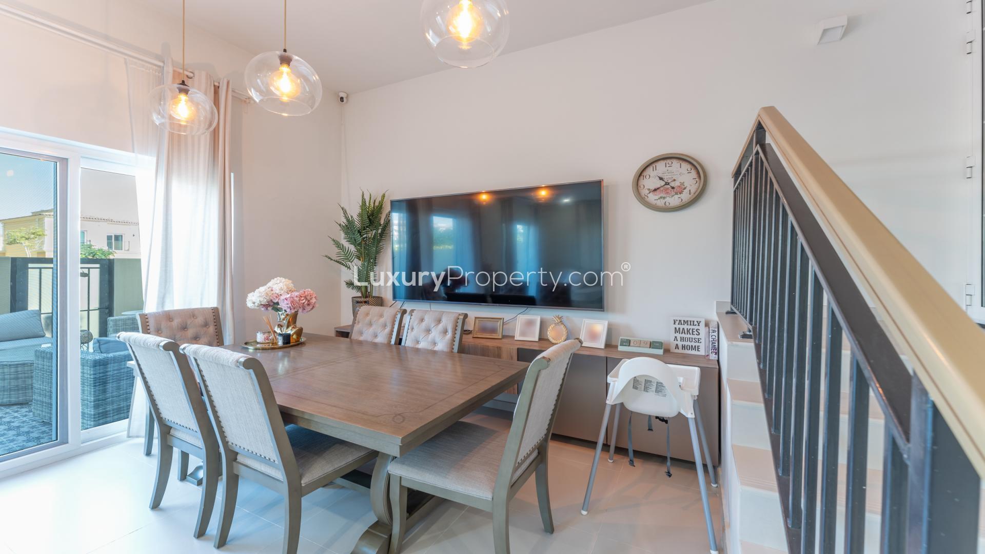 Modern living room in Villanova townhouse, Dubai Land; cozy seating and decor