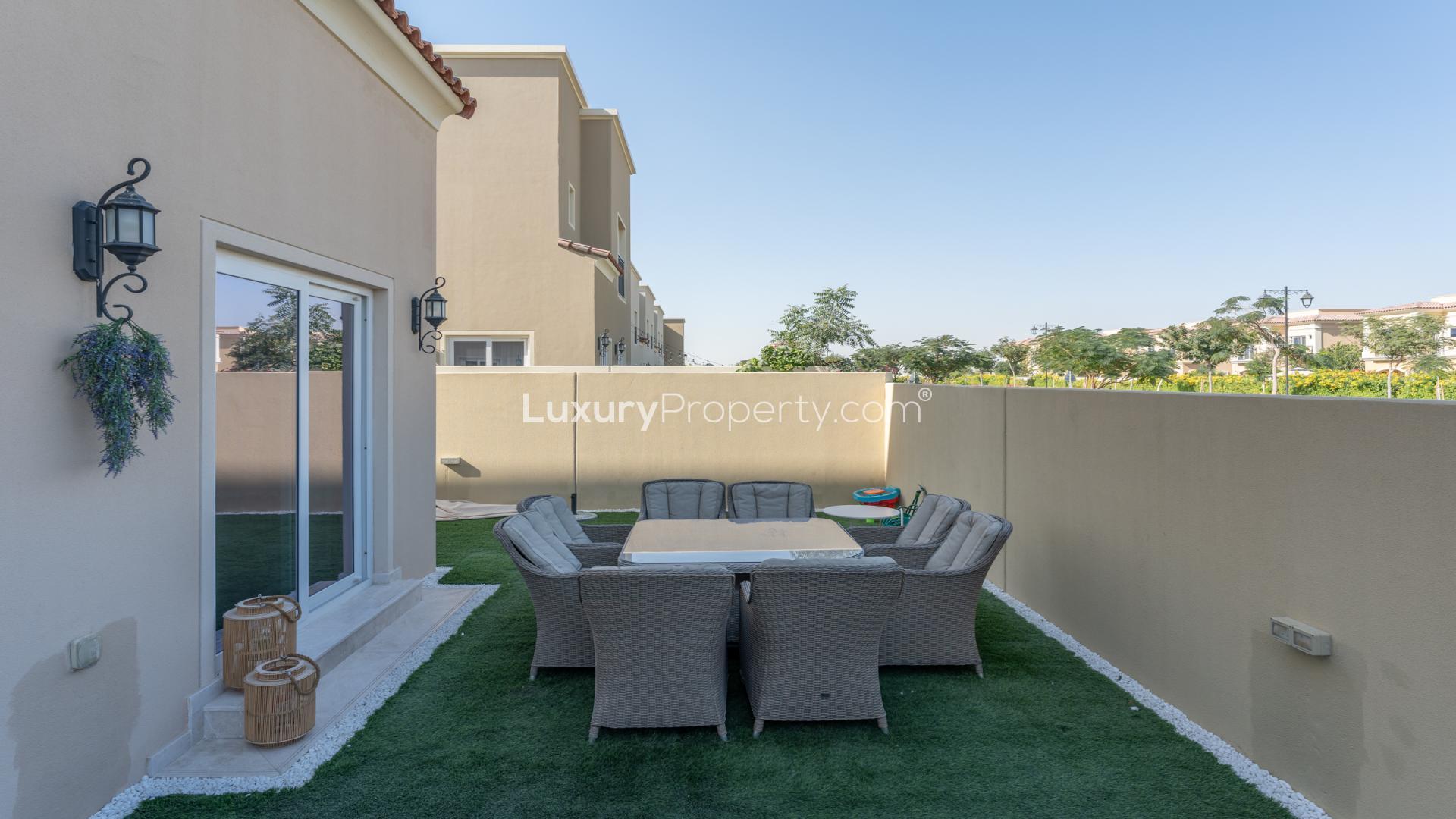 Modern living room in Villanova townhouse, Dubai Land, featuring stylish decor and cozy seating