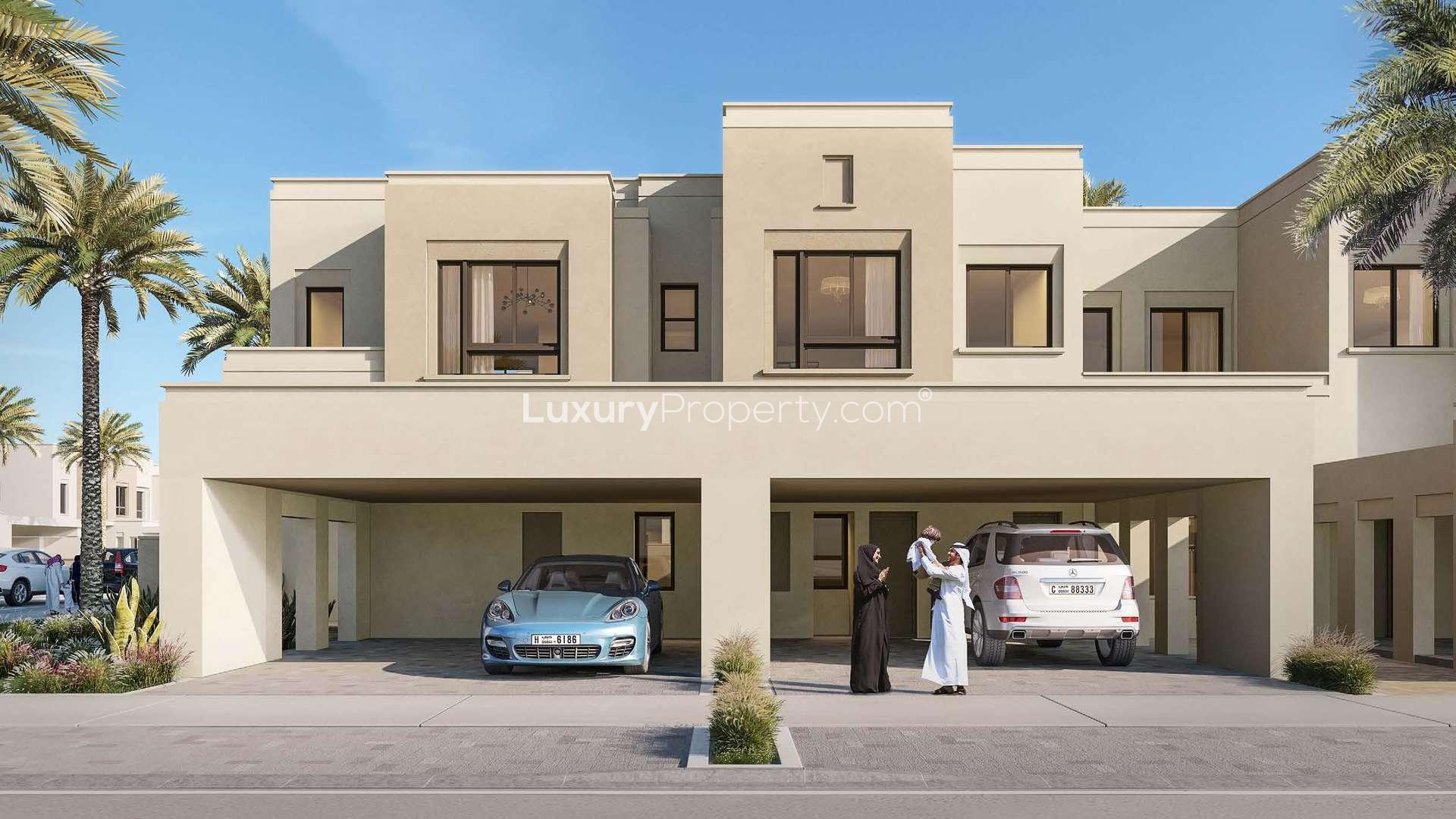 Elegant 4-bedroom townhouse exterior in Sama Townhouses, Dubai Town Square, with two-car garage