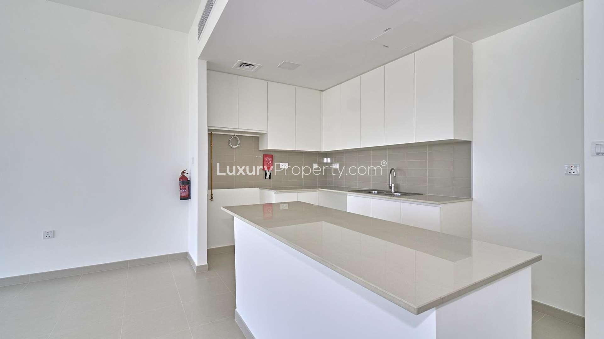 Stunning 4-bedroom townhouse exterior in Sama, Town Square, Dubai, with desert view