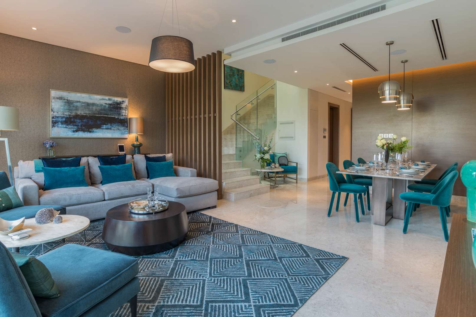 "Elegant living room view in Sobha Hartland townhouse, MBR City, for sale.",Elegant living and dining area in Sobha Hartland townhouse, MBR City