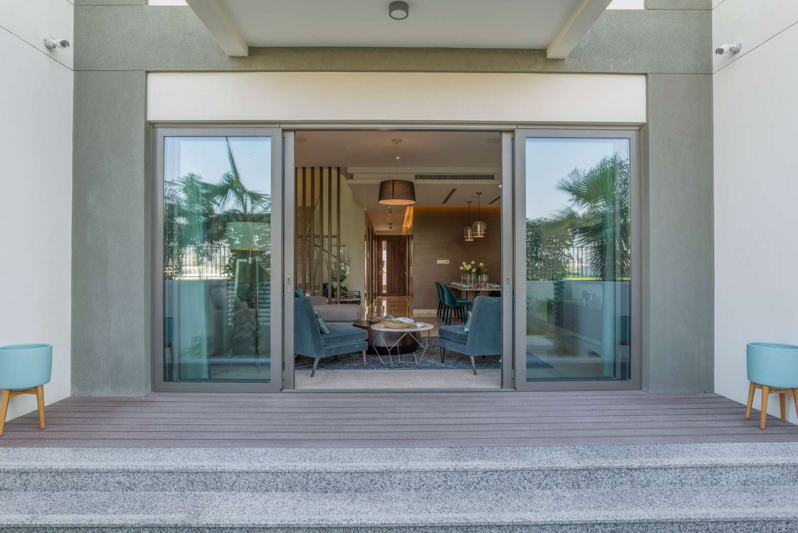 Elegant dining area in Sobha Hartland townhouse, featuring modern decor and natural lighting