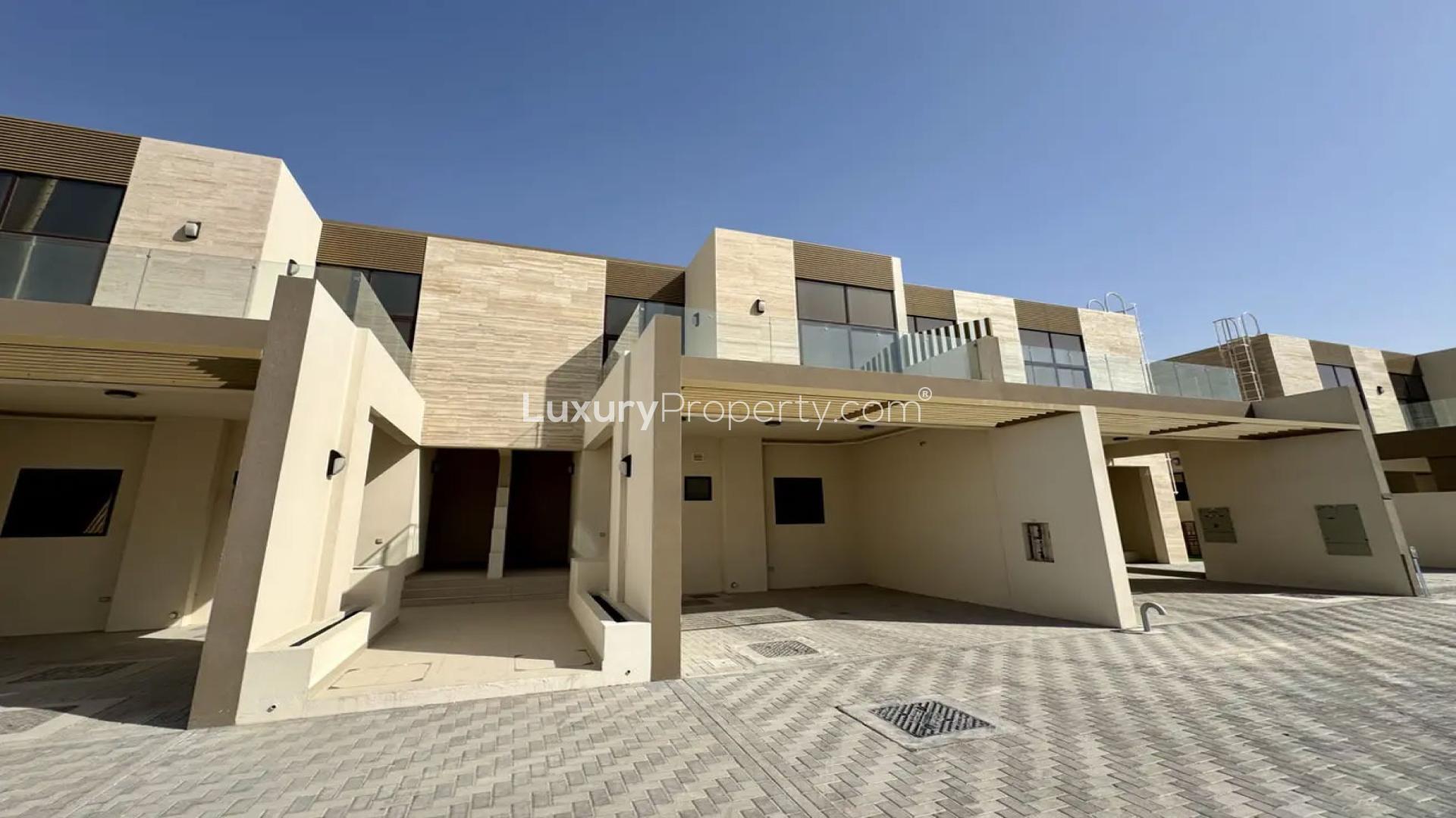 Four-bedroom townhouse patio with large glass doors in The Fields, Mohammed Bin Rashid City