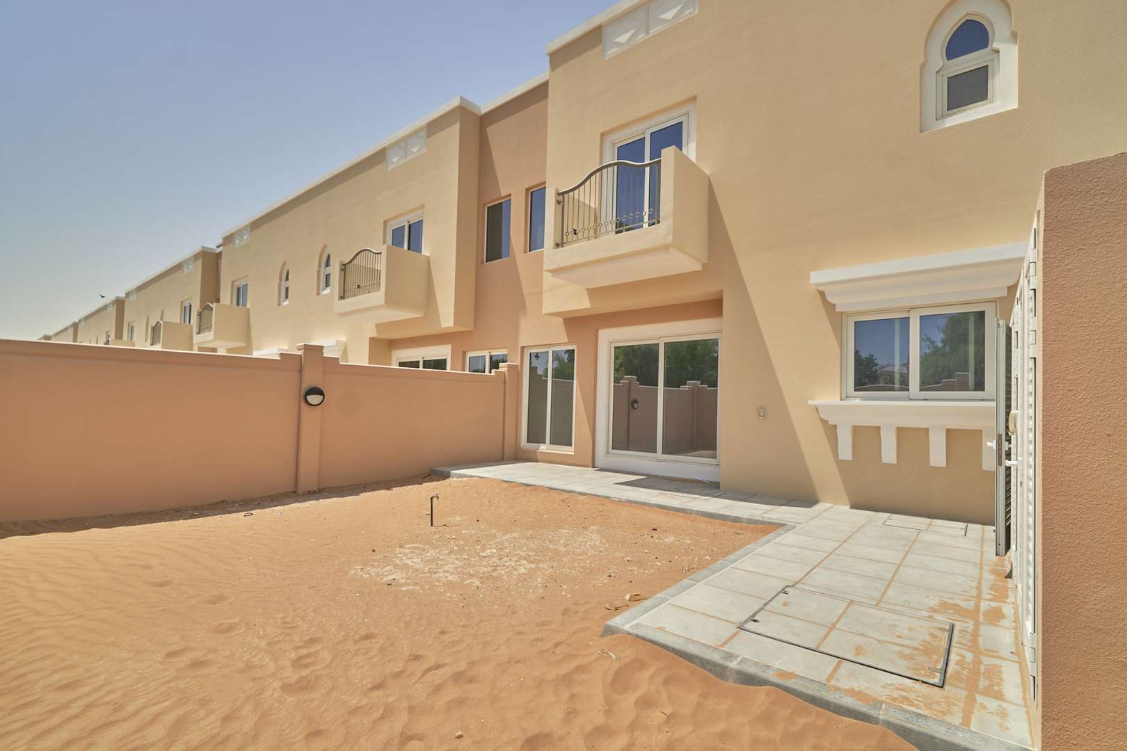 Contemporary 4-bedroom townhouse exterior in Marbella, Victory Heights, Dubai Sports City for sale