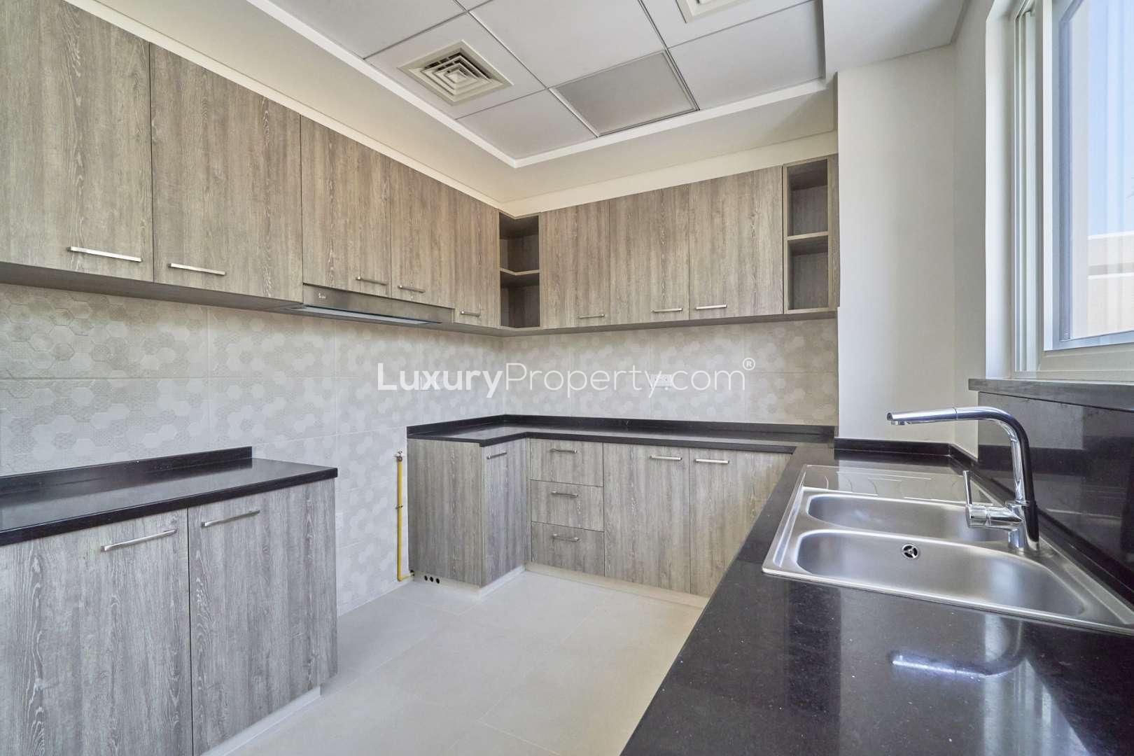 Contemporary townhouse exterior with patio in Marbella, Victory Heights, Dubai Sports City