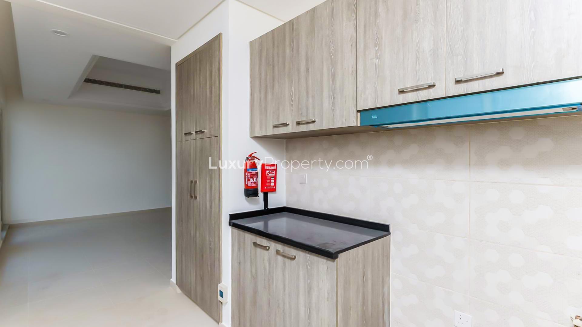 Modern kitchen cabinetry in four-bedroom townhouse, Victory Heights, Dubai Sports City, for sale