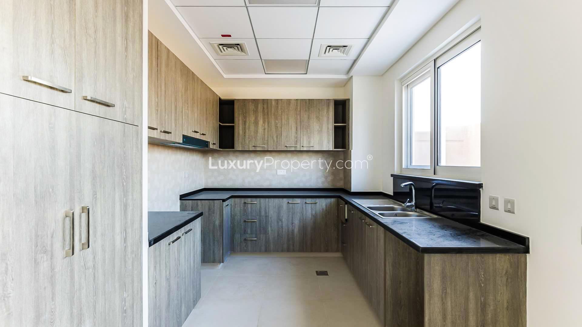 N/A,Modern kitchen in four-bedroom townhouse, Victory Heights, Dubai Sports City
