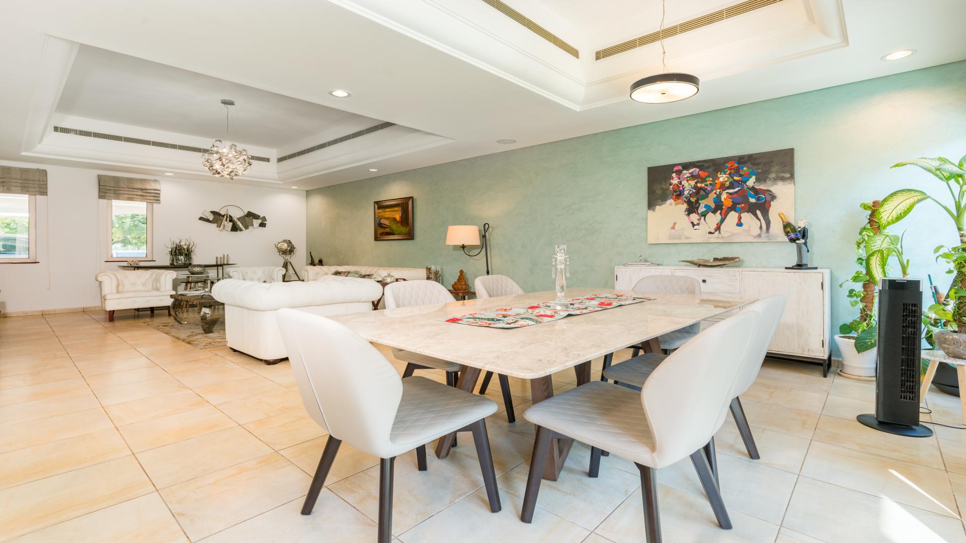 Living room with elegant decor in upgraded Dubai Sports City townhouse, Victory Heights