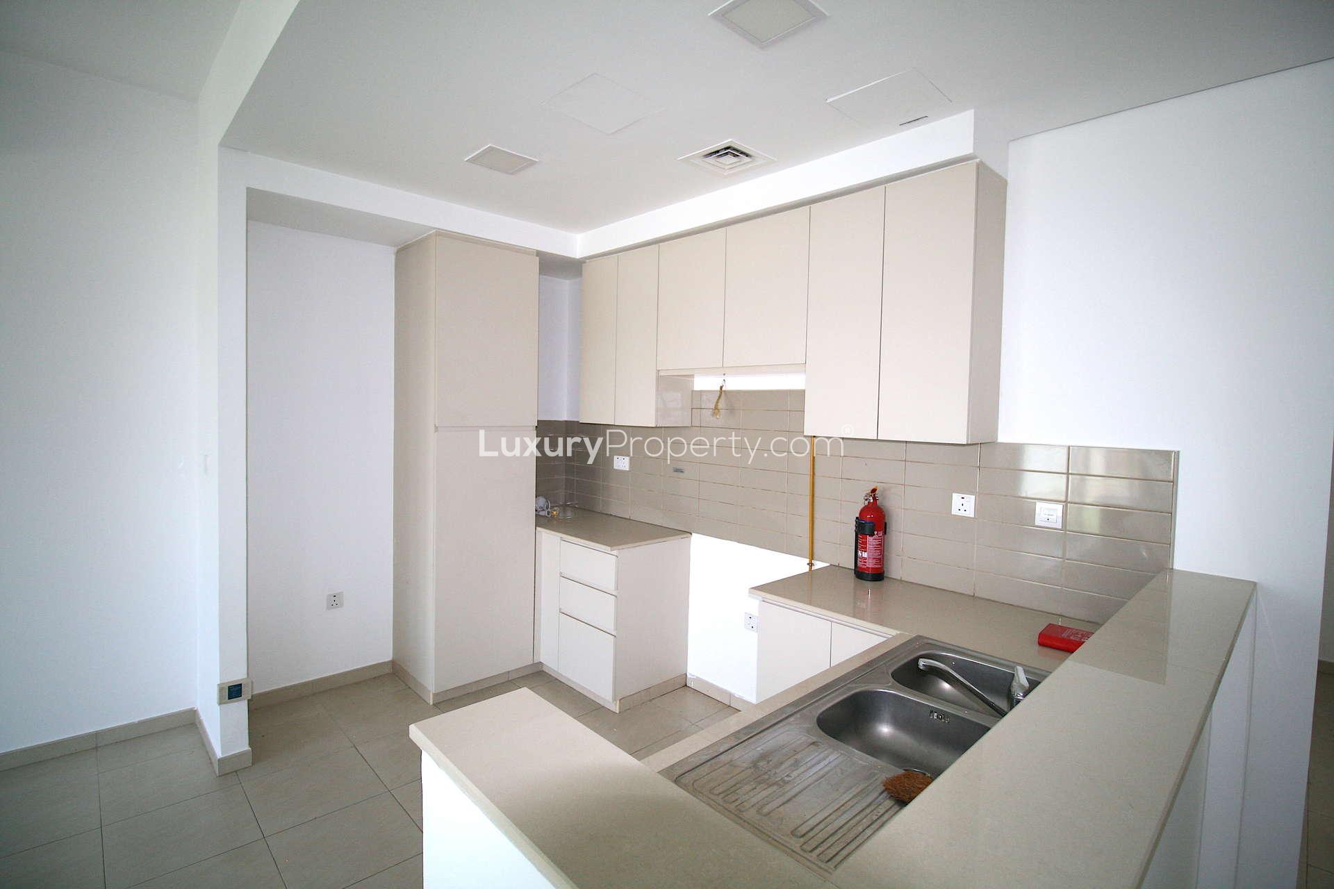 Modern kitchen and living area in 4-bedroom townhouse, Zahra, Dubai Town Square