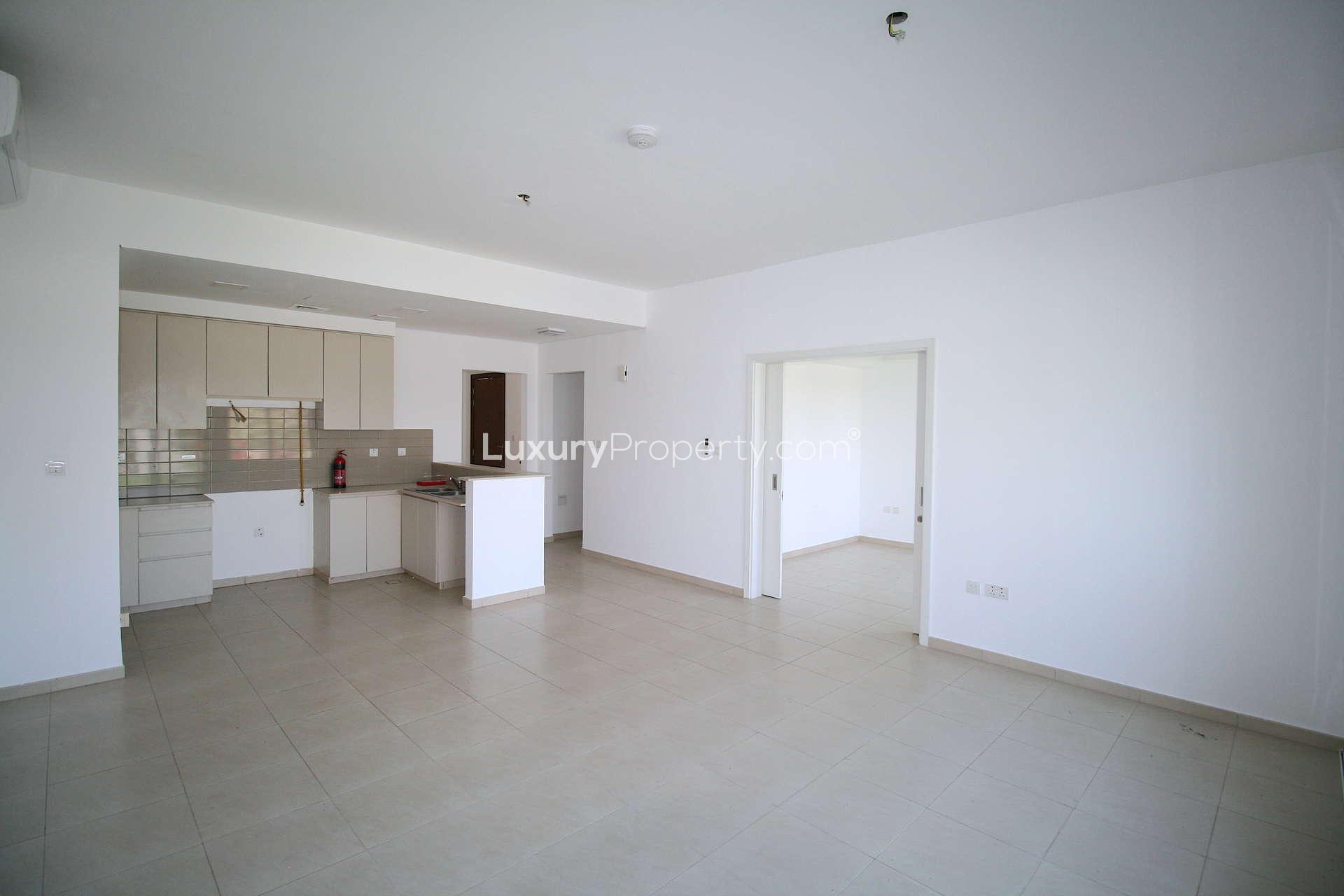 Spacious living area in Zahra Townhouses, Town Square, 4-bed townhouse for rent