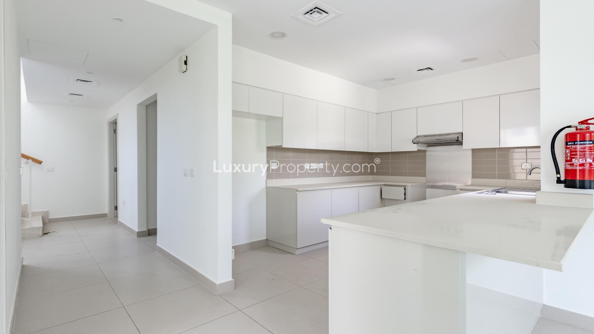 Exquisite 4-bedroom villa exterior in Maple at Dubai Hills Estate, lush greenery surrounds