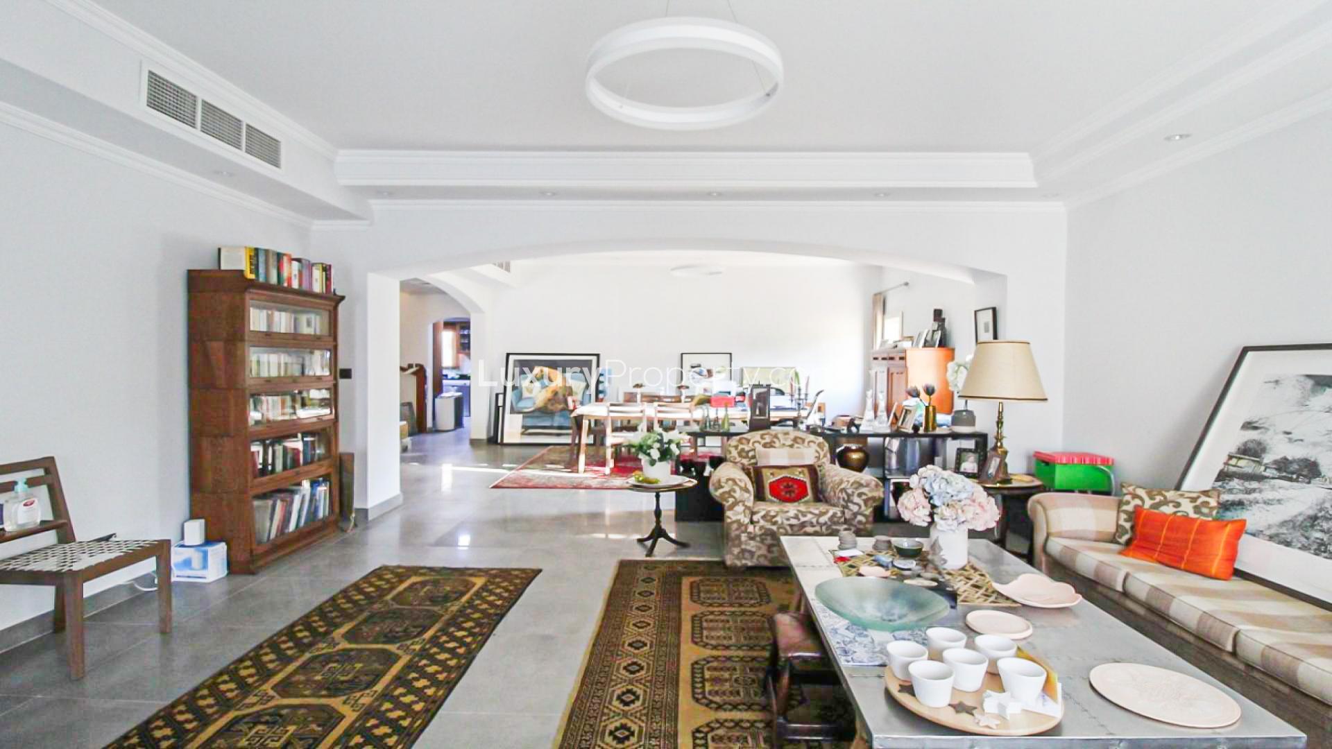 Living room in upgraded 4-bedroom villa, Meadows 9, with elegant decor and cozy seating