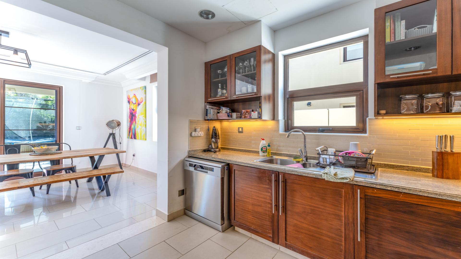 Modern living room in 3-bedroom villa, Arabian Ranches 2, featuring stylish decor and natural light