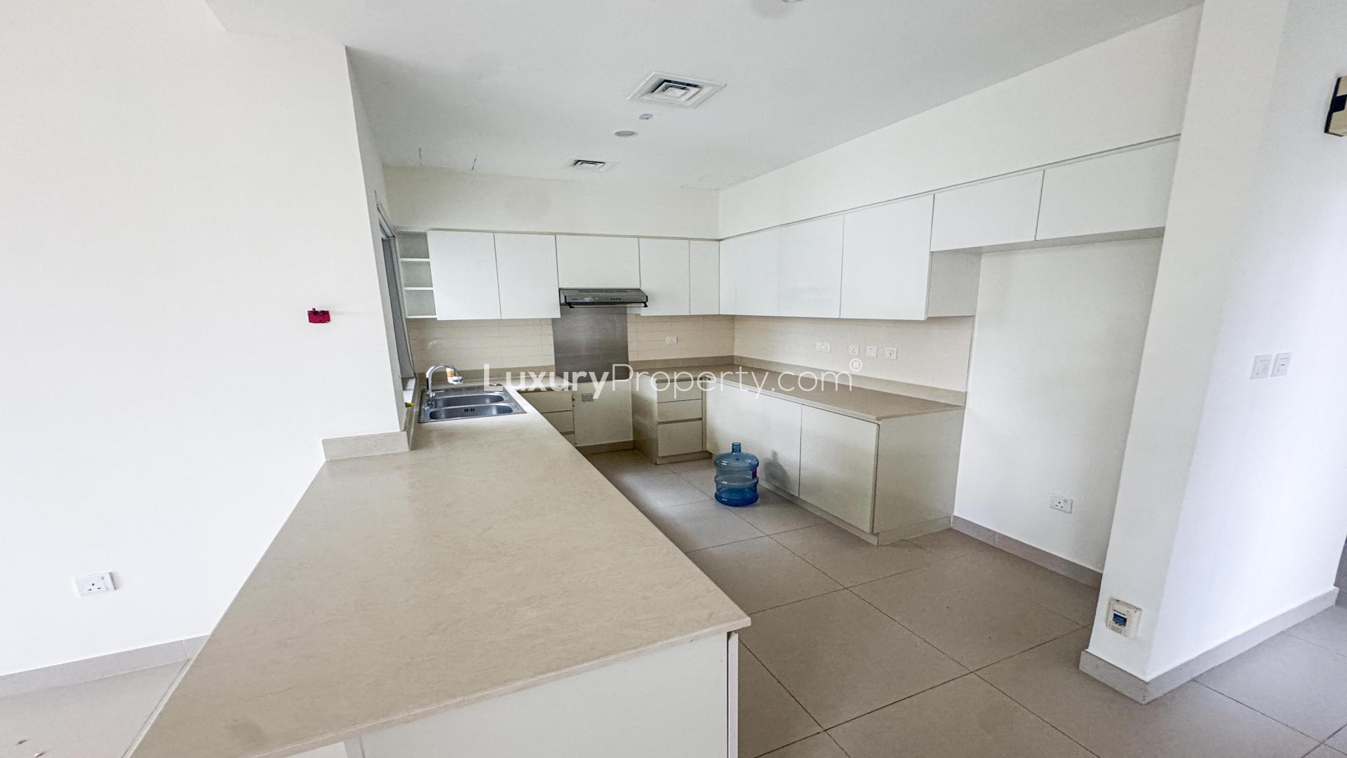 Bright bedroom in Maple 3 villa, Dubai Hills Estate, with large window and neutral decor